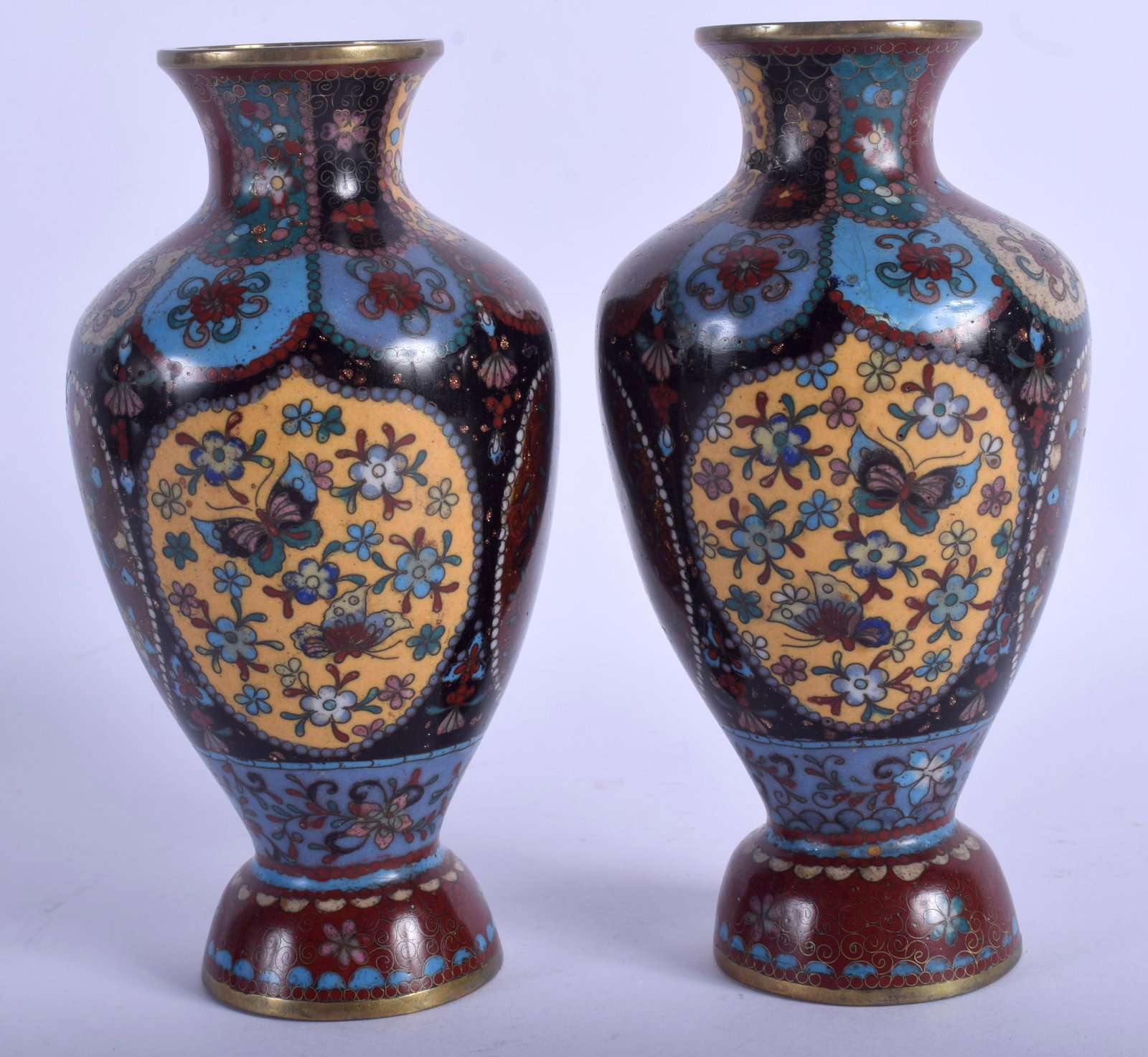 A PAIR OF JAPANESE MEIJI PERIOD CLOISONNE ENAMEL: A PAIR OF JAPANESE MEIJI PERIOD CLOISONNE ENAMEL BALUSTER VASE, decorated with foliage. 17.5 cm high.