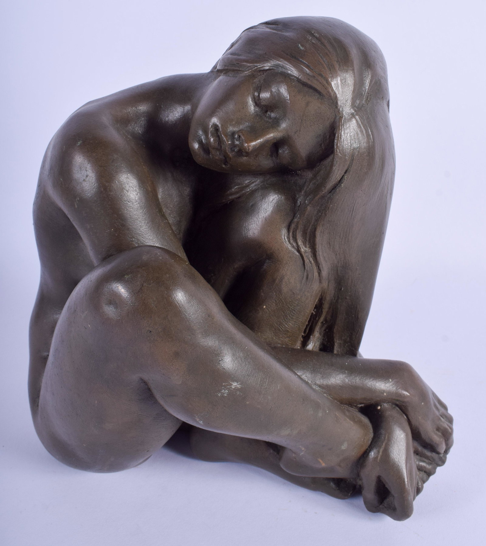 A 1980S CARVED EUROPEAN VOLCANIC LAVA STONE FIGURE OF A: A 1980S CARVED EUROPEAN VOLCANIC LAVA STONE FIGURE OF A NUDE FEMALE modelled resting. 19 cm x 23 cm.