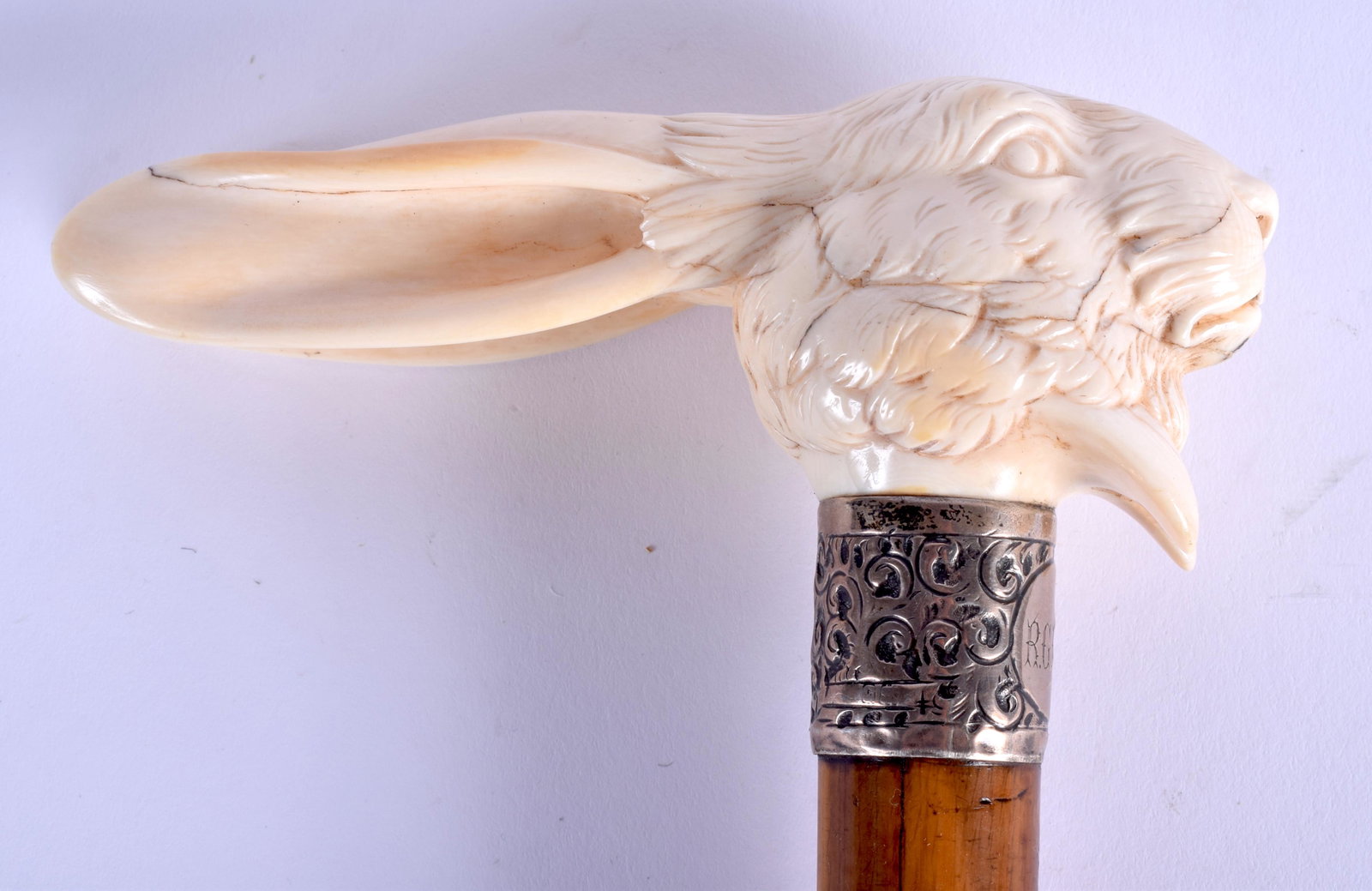 A RARE 19TH CENTURY CONTINENTAL CARVED BONE HARE HEAD: A RARE 19TH CENTURY CONTINENTAL CARVED BONE HARE HEAD WALKING CANE with rococo plated ferrel. 83 cm long.