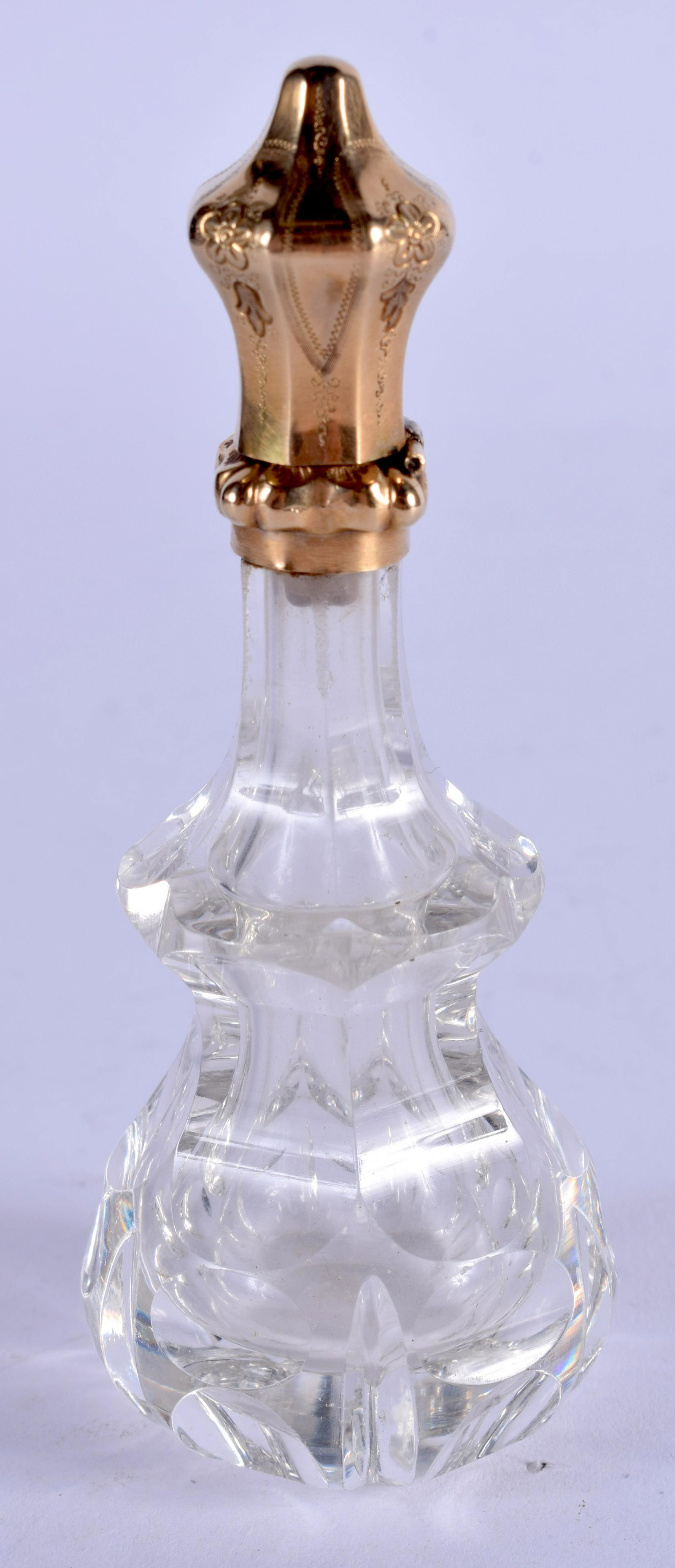 AN ANTIQUE FRENCH GOLD AND CRYSTAL GLASS SCENT BOTTLE.: AN ANTIQUE FRENCH GOLD AND CRYSTAL GLASS SCENT BOTTLE. 8.5 cm high.