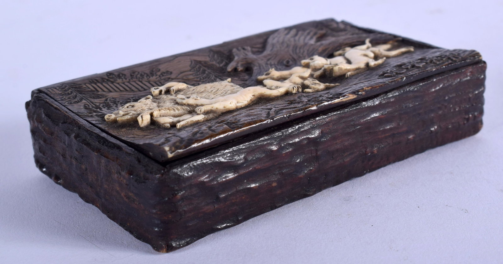 A 19TH CENTURY BAVARIAN BLACK FOREST CARVED BONE AND: A 19TH CENTURY BAVARIAN BLACK FOREST CARVED BONE AND ANTLER HORN SNUFF BOX decorated with hunting scenes. 9 cm x 5.5 cm.