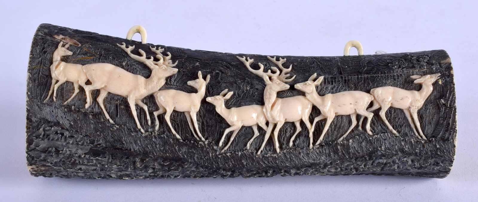 A 19TH CENTURY BAVARIAN BLACK FOREST CARVED HORN AND: A 19TH CENTURY BAVARIAN BLACK FOREST CARVED HORN AND BONE HANGING TUSK decorated with figures. 19 cm x 6 cm.