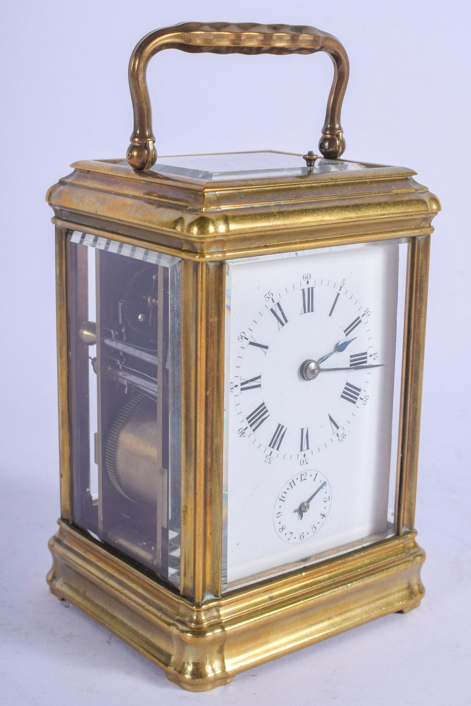 A 19TH CENTURY FRENCH REPEATING GRAND SONNERIE CARRIAGE: A 19TH CENTURY FRENCH REPEATING GRAND SONNERIE CARRIAGE CLOCK with dual plain enamelled dial. 15 cm high inc handle.