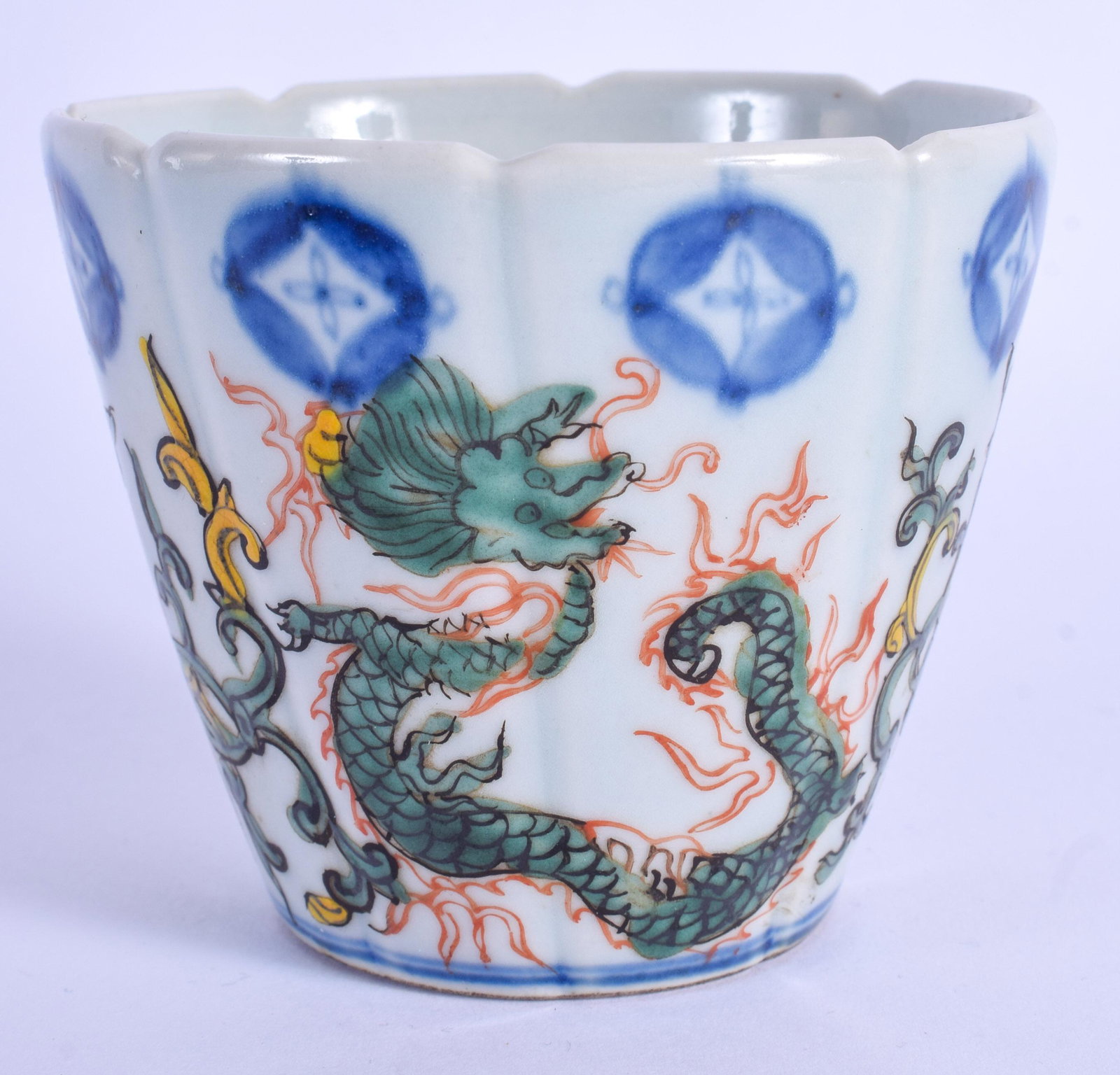 A CHINESE WUCAI PORCELAIN FACETTED BEAKER 20th Century,: A CHINESE WUCAI PORCELAIN FACETTED BEAKER 20th Century, enamelled with dragons. 7 cm x 8 cm.