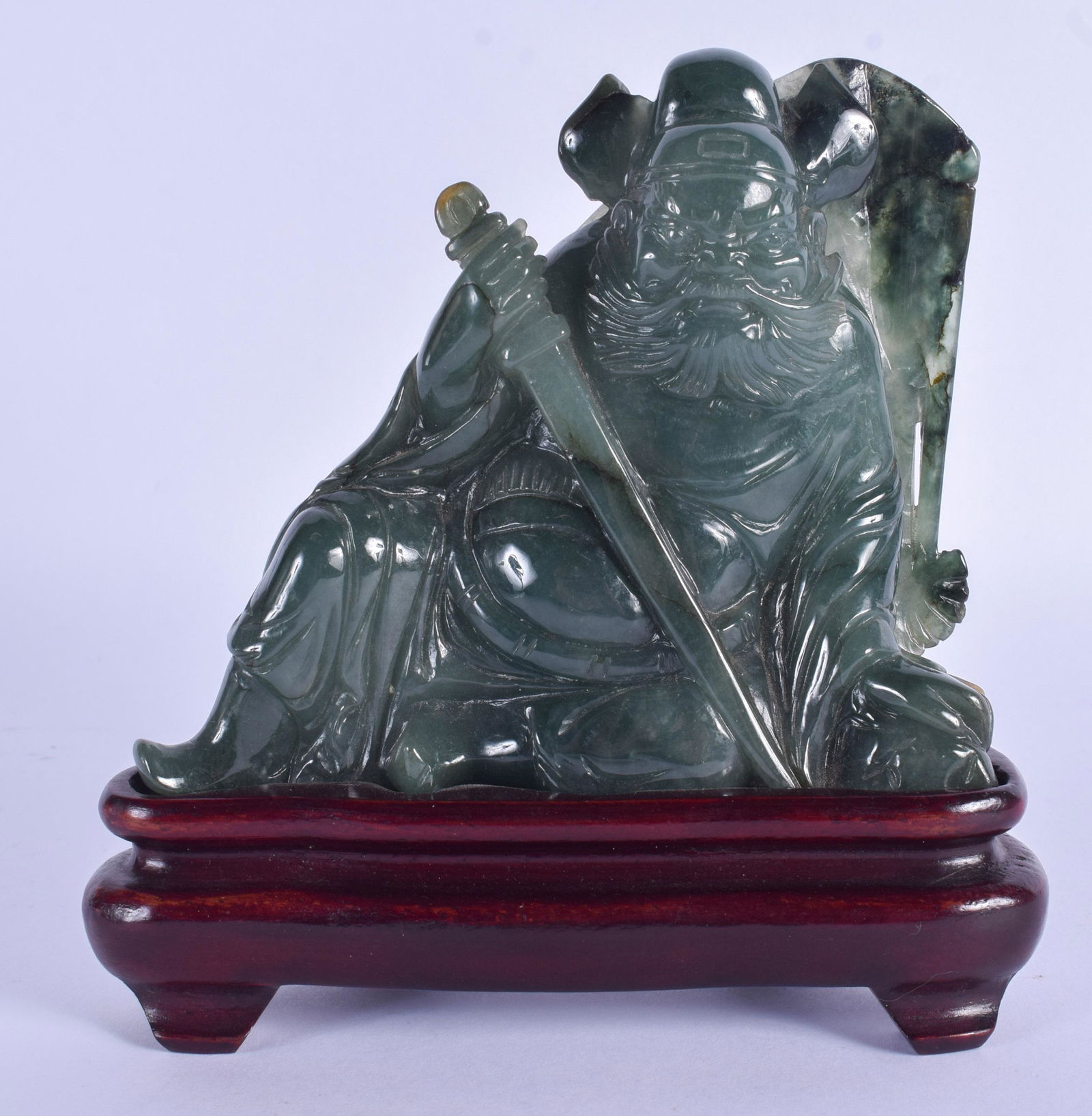 A 1930S CHINESE CARVED JADEITE FIGURE OF A WARRIOR (1 of 2)
