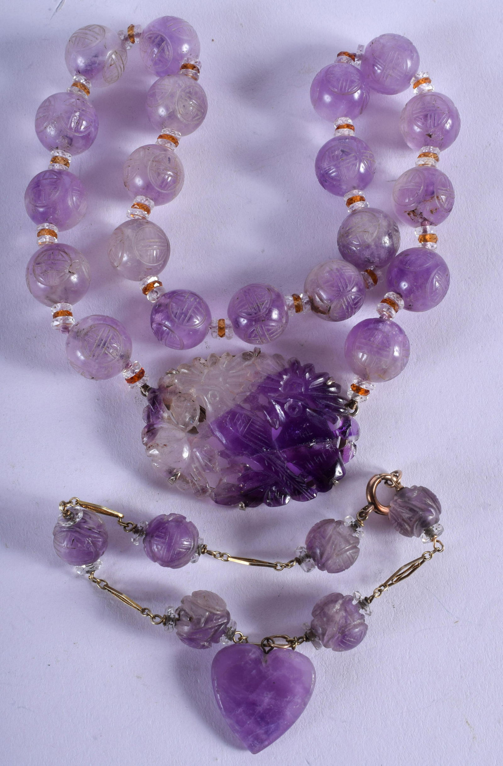 A 1930S CHINESE CARVED AMETHYST NECKLACE together with (1 of 2)