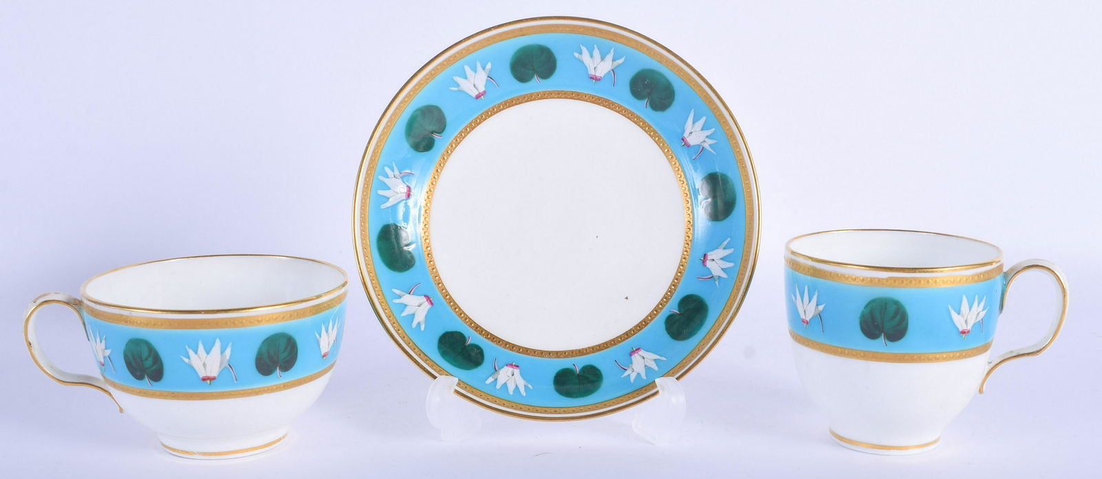 19th c. Minton teacup, coffee cup and saucer painted: 19th c. Minton teacup, coffee cup and saucer painted after Sir Christopher Dresser with an alternating green leaf and white enamel flowerhead design on a turquoise ground impressed mark