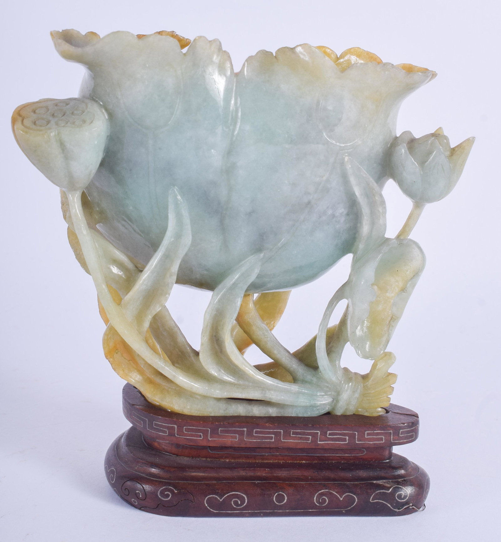AN EARLY 20TH CENTURY CHINESE CARVED JADEITE BRUSH: AN EARLY 20TH CENTURY CHINESE CARVED JADEITE BRUSH WASHER Qing, of naturalistic form. Jadeite 10 cm x 8.5 cm.