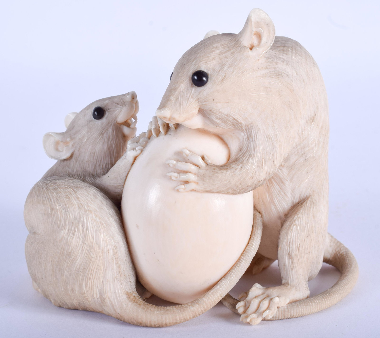 A FINE 19TH CENTURY JAPANESE MEIJI PERIOD CARVED BONE: A FINE 19TH CENTURY JAPANESE MEIJI PERIOD CARVED BONE OKIMONO Attributed to Tadachika, modelled as two rats. 10 cm x 8.5 cm.