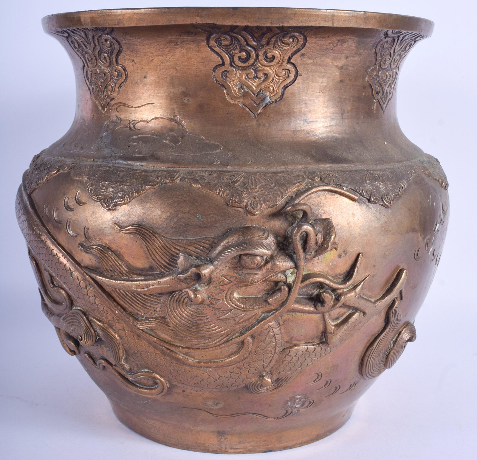 A LARGE 19TH CENTURY JAPANESE MEIJI PERIOD BRASS: A LARGE 19TH CENTURY JAPANESE MEIJI PERIOD BRASS PLANTER decorated in relief with a dragon. 21 cm x 23 cm.