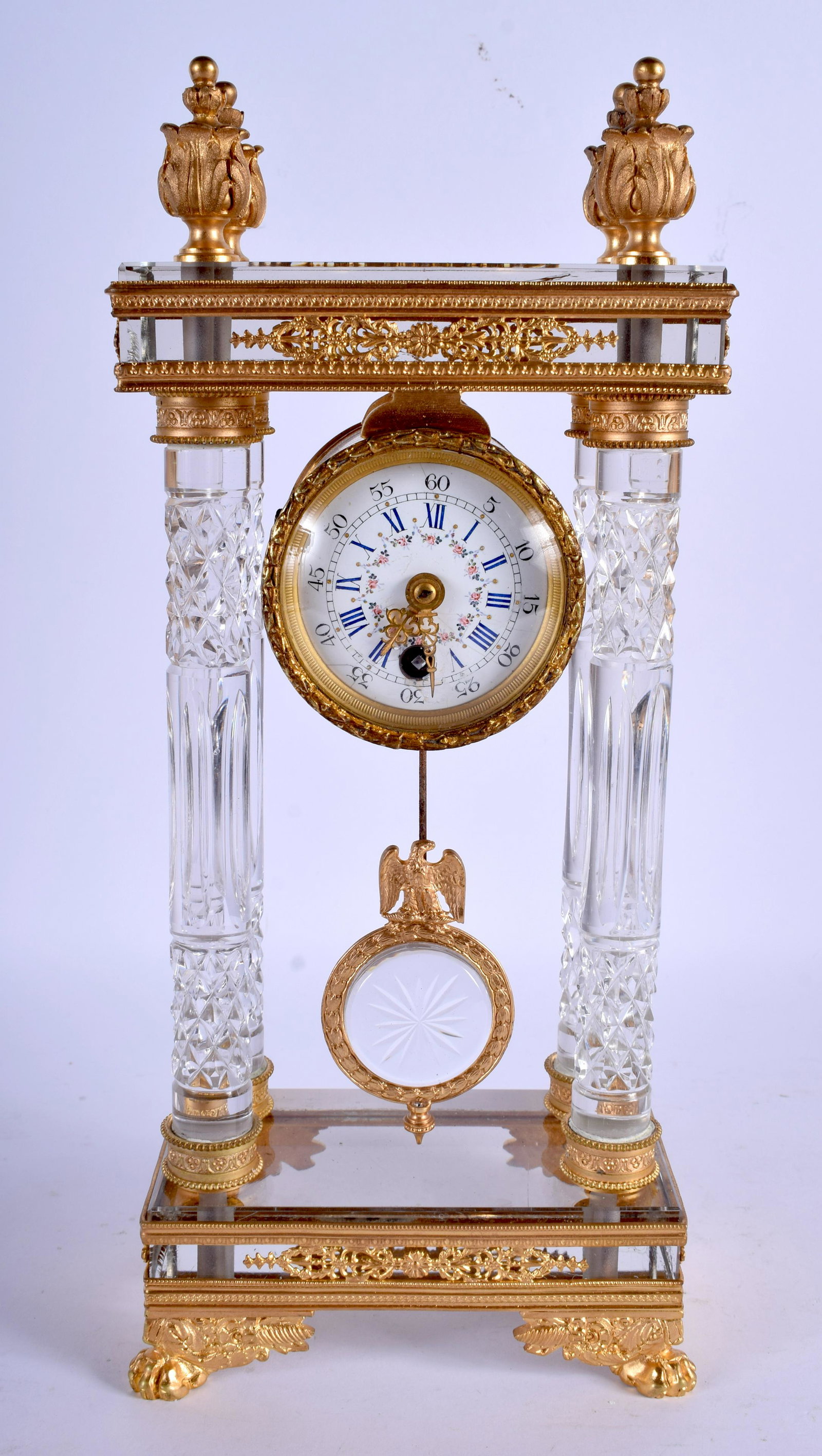 A RARE EARLY 20TH CENTURY FRENCH CUT CRYSTAL AND ORMOLU: A RARE EARLY 20TH CENTURY FRENCH CUT CRYSTAL AND ORMOLU CLOCK of neo classical form. 31 cm x 11 cm.