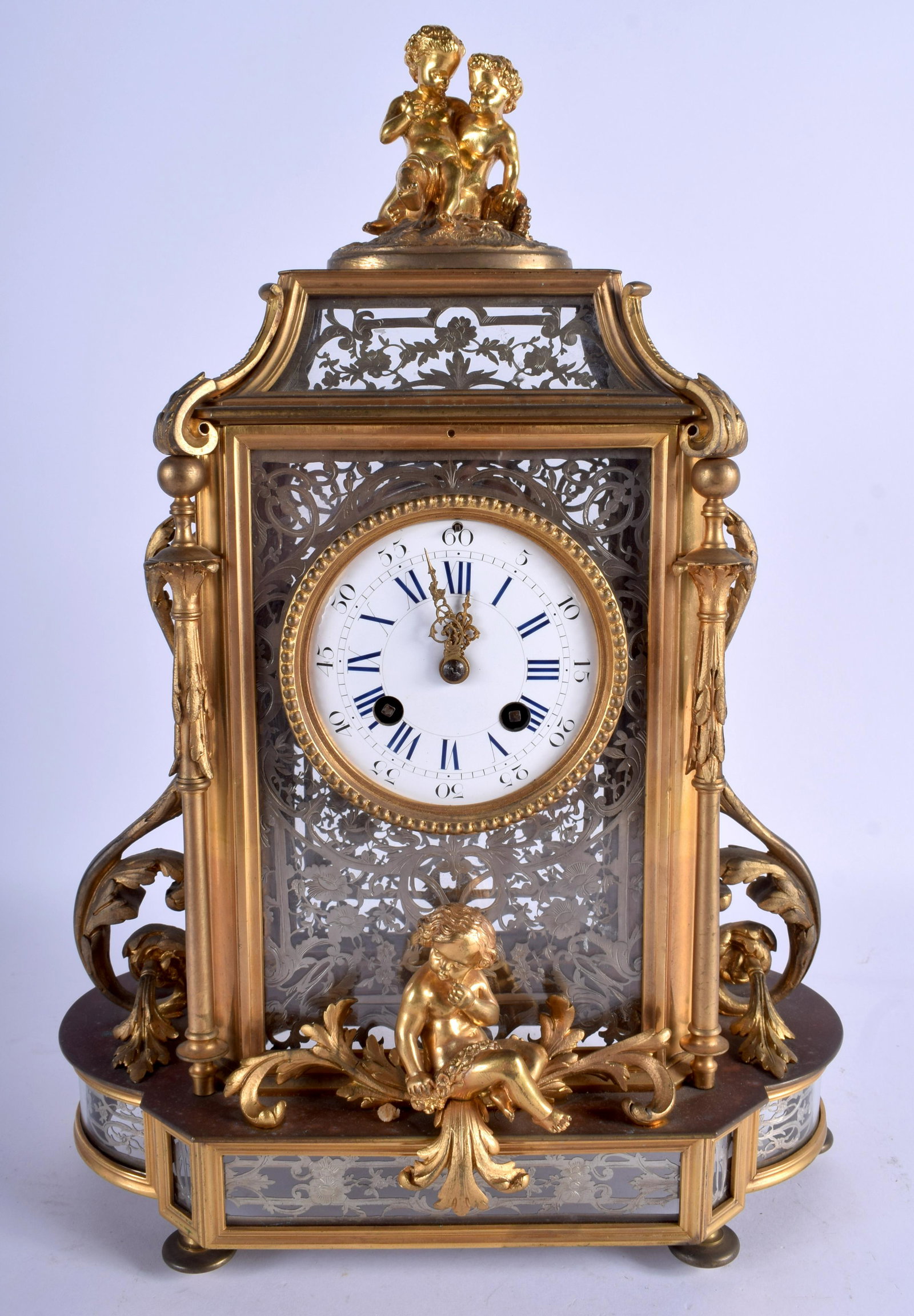 A RARE 19TH CENTURY FRENCH ORMOLU AND CRYSTAL GLASS: A RARE 19TH CENTURY FRENCH ORMOLU AND CRYSTAL GLASS MANTEL CLOCK with quality silver overlaid panels. 39 cm x 20 cm.
