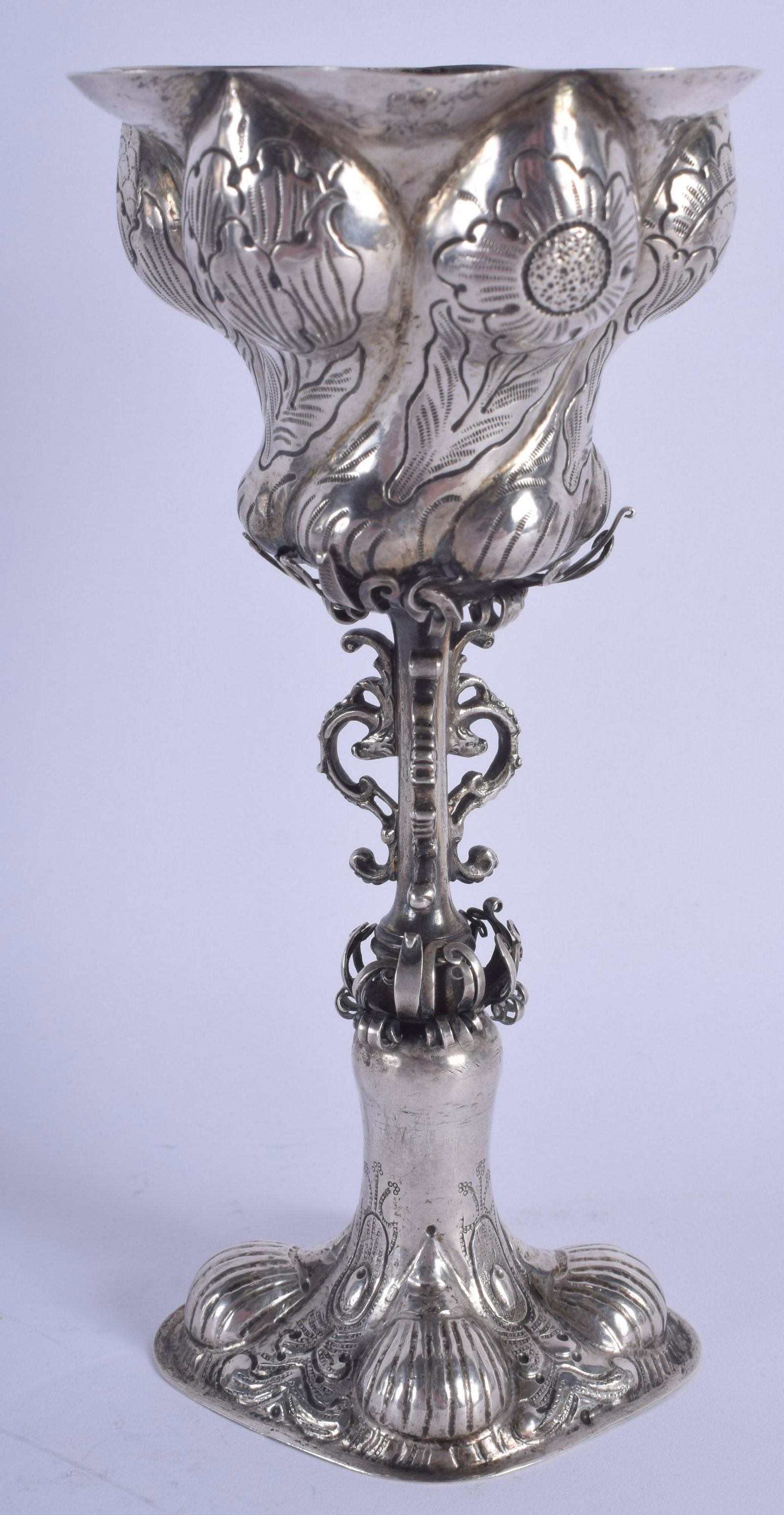 A MID 19TH CENTURY CONTINENTAL SILVER LOBED BEAKER: A MID 19TH CENTURY CONTINENTAL SILVER LOBED BEAKER engraved with foliage and vines. 180 grams. 18 cm high.