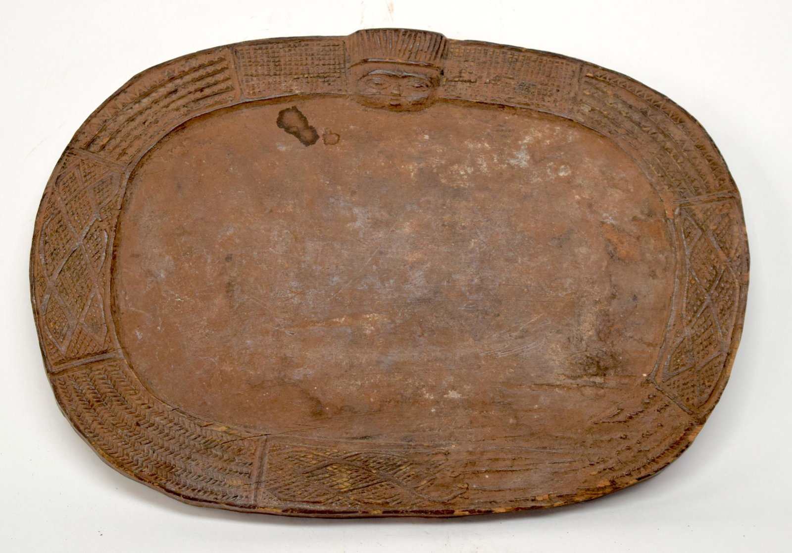 A TRIBAL YORUBA DIVINATION PLATE (OPON IFA). Nig: A TRIBAL YORUBA DIVINATION PLATE (OPON IFA). Nigeria. 22cm x 3cm x 33cm