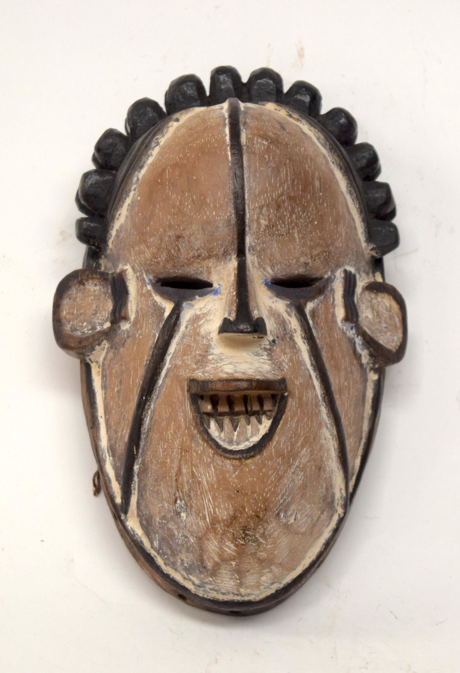 A TRIBAL IGBO MASK. Nigeria. 13cm x 9cm x 22cm: A TRIBAL IGBO MASK. Nigeria. 13cm x 9cm x 22cm