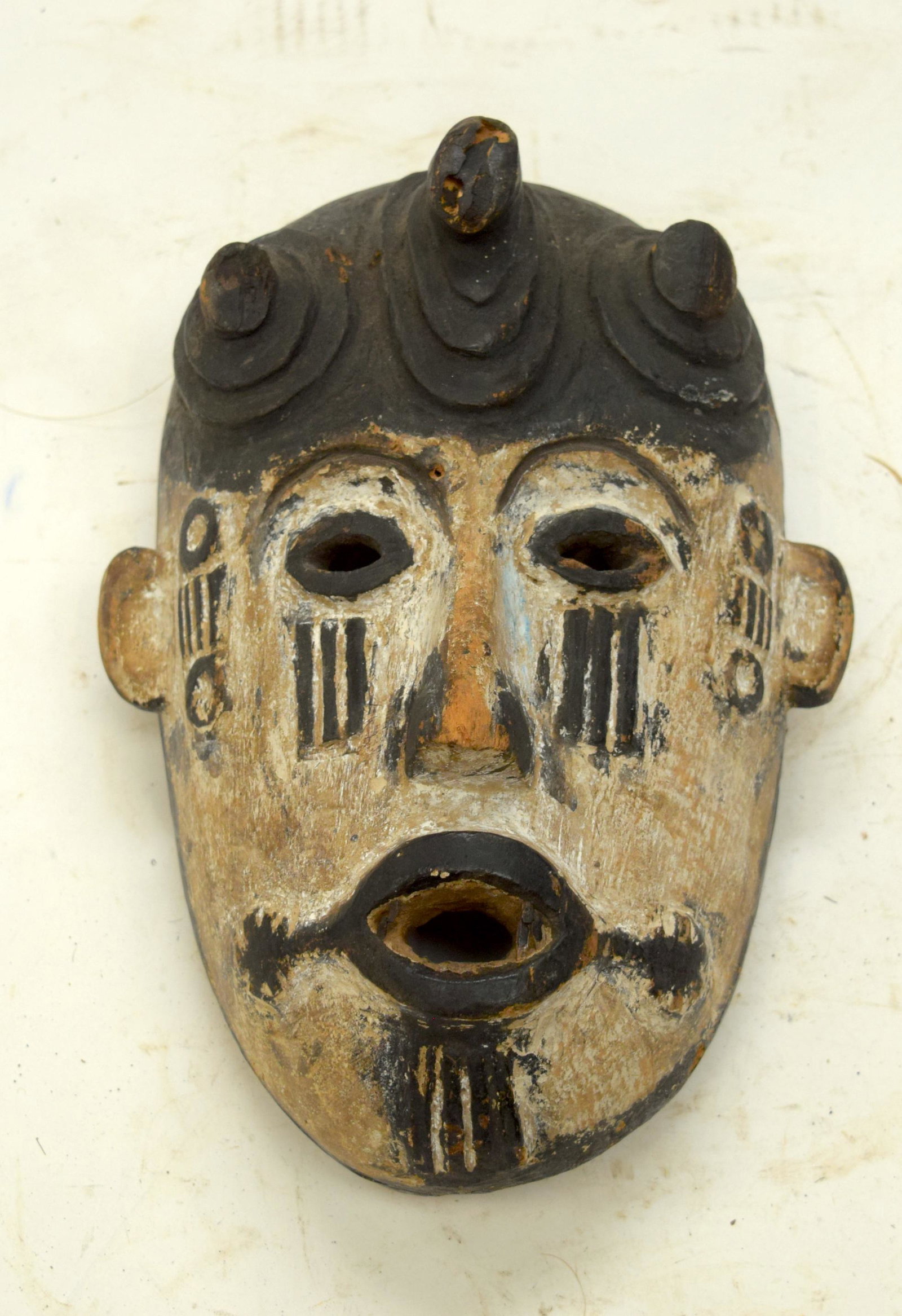 A TRIBAL IGBO MASK. Nigeria. 15cm x 10cm x 22cm: A TRIBAL IGBO MASK. Nigeria. 15cm x 10cm x 22cm