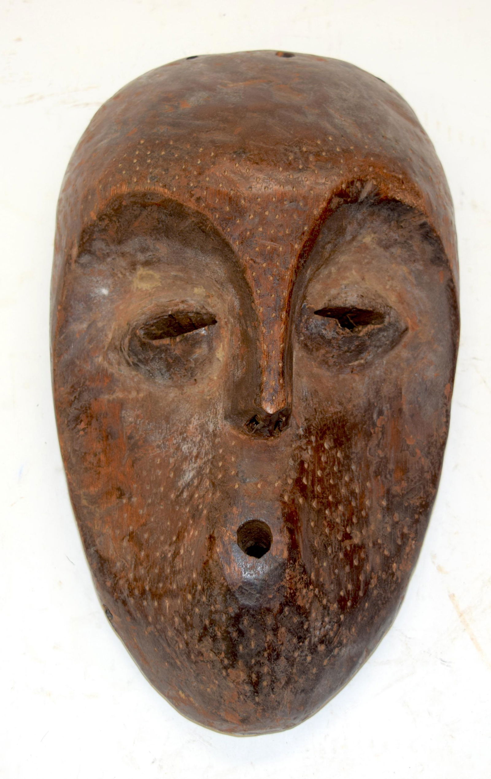 A TRIBAL LEGA MASK.  DR Congo.  16cm x 9cm x 29cm (1 of 3)