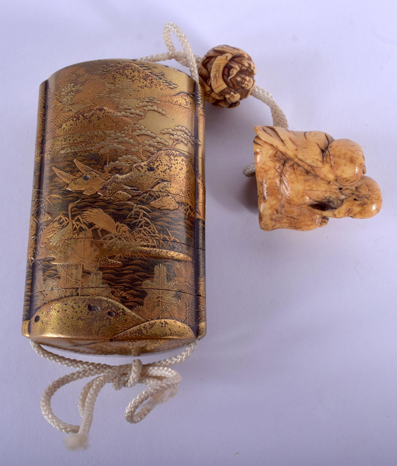 A LOVELY 19TH CENTURY JAPANESE MEIJI PERIOD SIX S: A LOVELY 19TH CENTURY JAPANESE MEIJI PERIOD SIX SECTION GOLD LACQUER INRO with attached bone toggle and stag antler netsuke. Inro 8.5 cm x 5.5 cm.