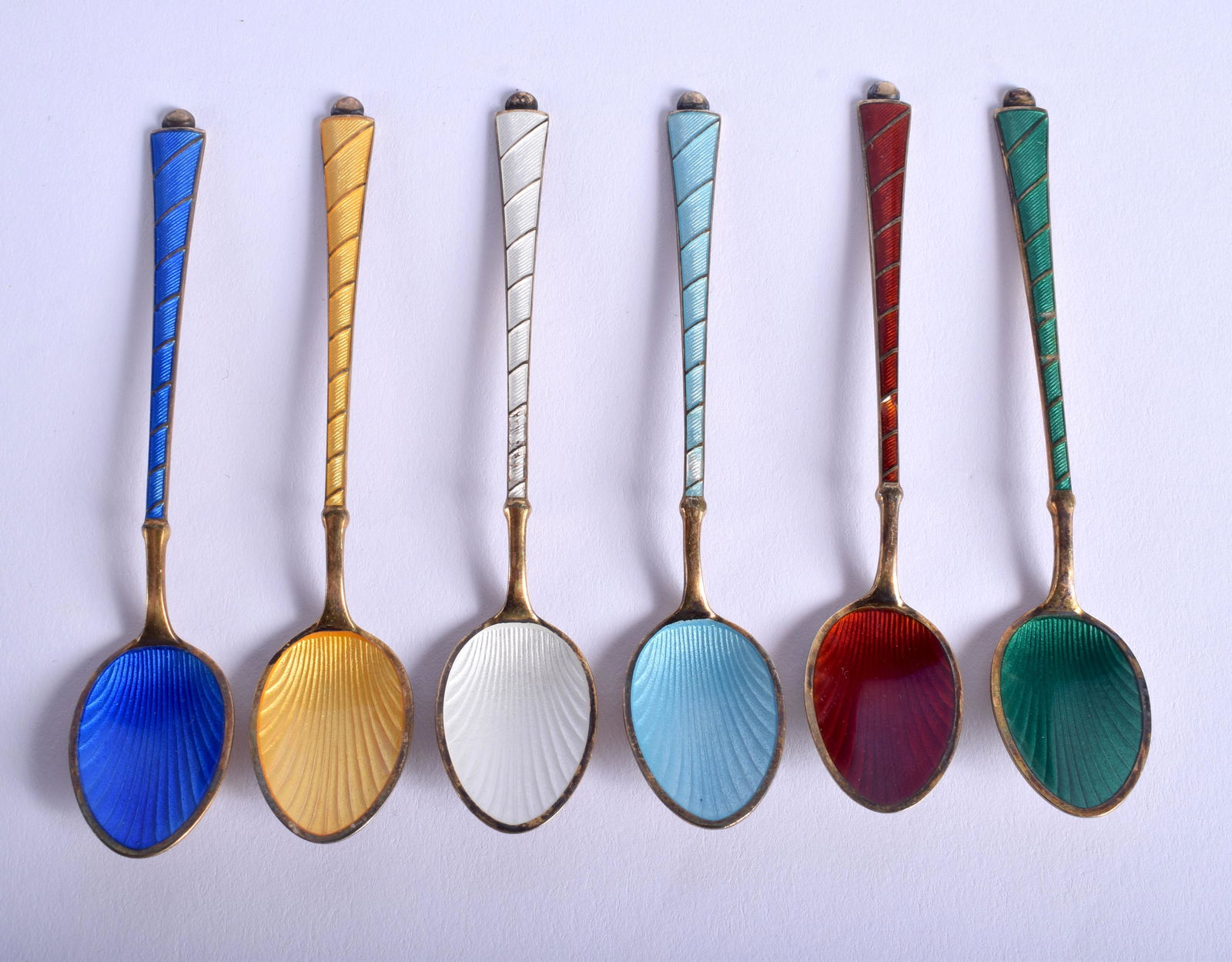 A SET OF DANISH SILVER GILT AND ENAMEL SPOONS. (6 (1 of 3)
