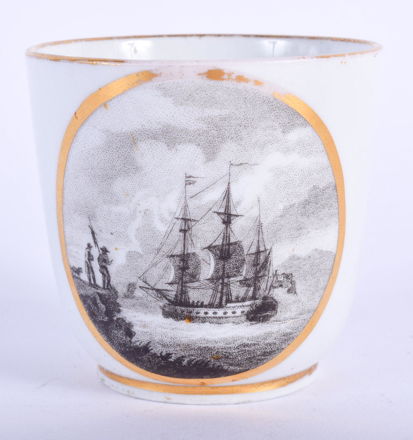AN 18TH CENTURY WOLFE-MASON (FACTORY Z) COFFEE CU: AN 18TH CENTURY WOLFE-MASON (FACTORY Z) COFFEE CUP well painted with a sailing ship in harbour watched by two men, Tim Olney collection label. 6 cm wide.
