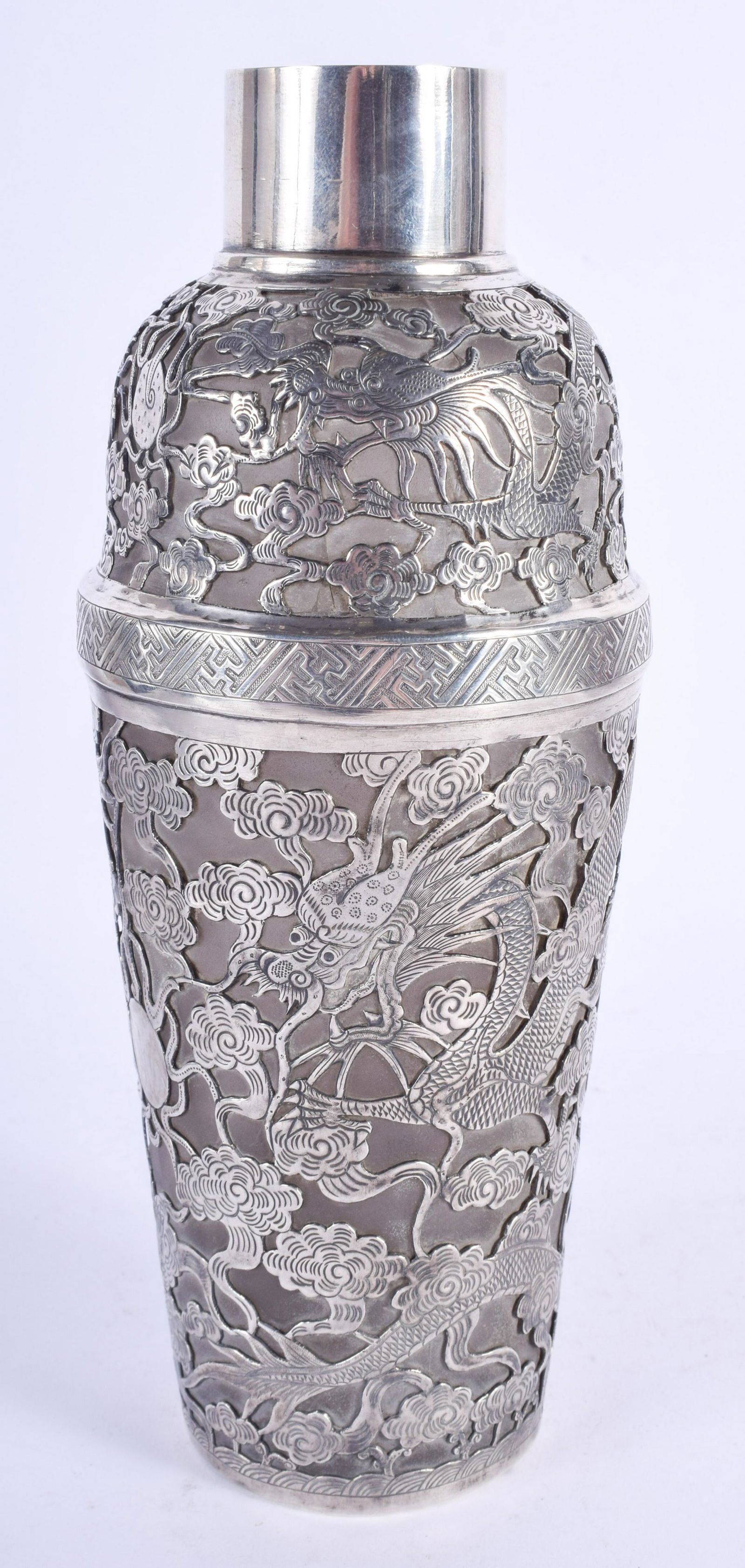 AN EARLY 20TH CENTURY CHINESE SILVER OVERLAID COC (1 of 3)