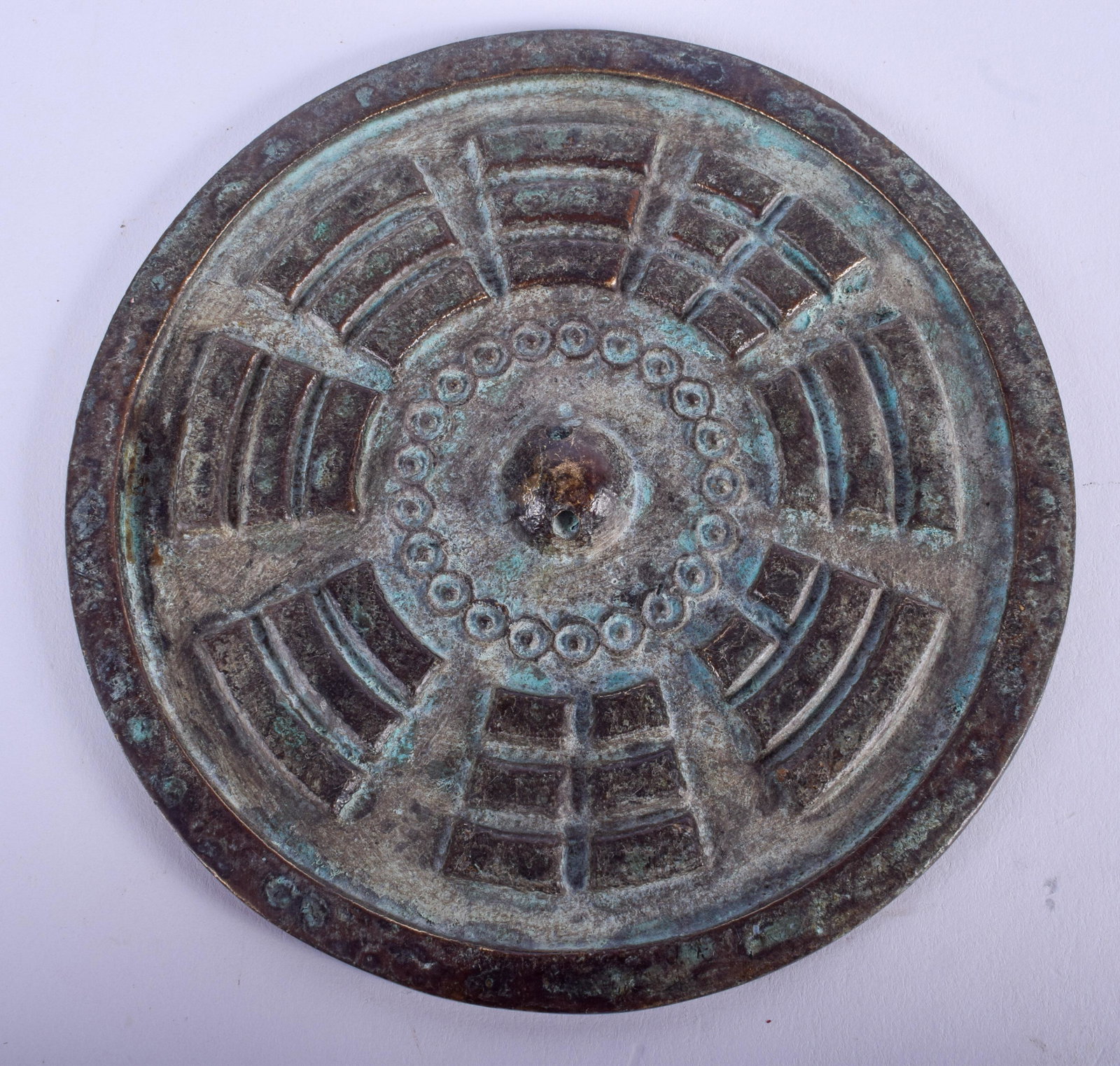 A CHINESE BRONZE HAND MIRROR. 11 cm wide.: A CHINESE BRONZE HAND MIRROR. 11 cm wide.