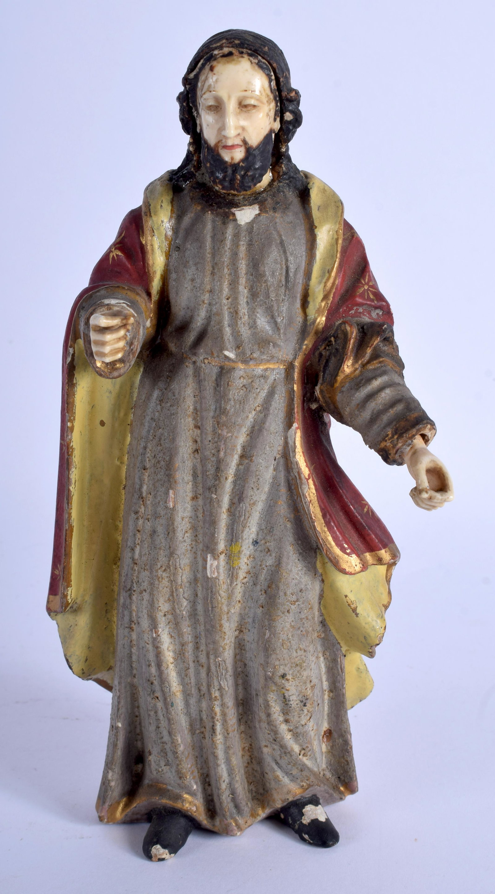 AN 18TH CENTURY CONTINENTAL BONE AND LACQUERED WOOD: AN 18TH CENTURY CONTINENTAL BONE AND LACQUERED WOOD FIGURE OF SAINT possibly Spanish-Filipino School, modelled with hands out stretched. 20 cm x 7 cm.