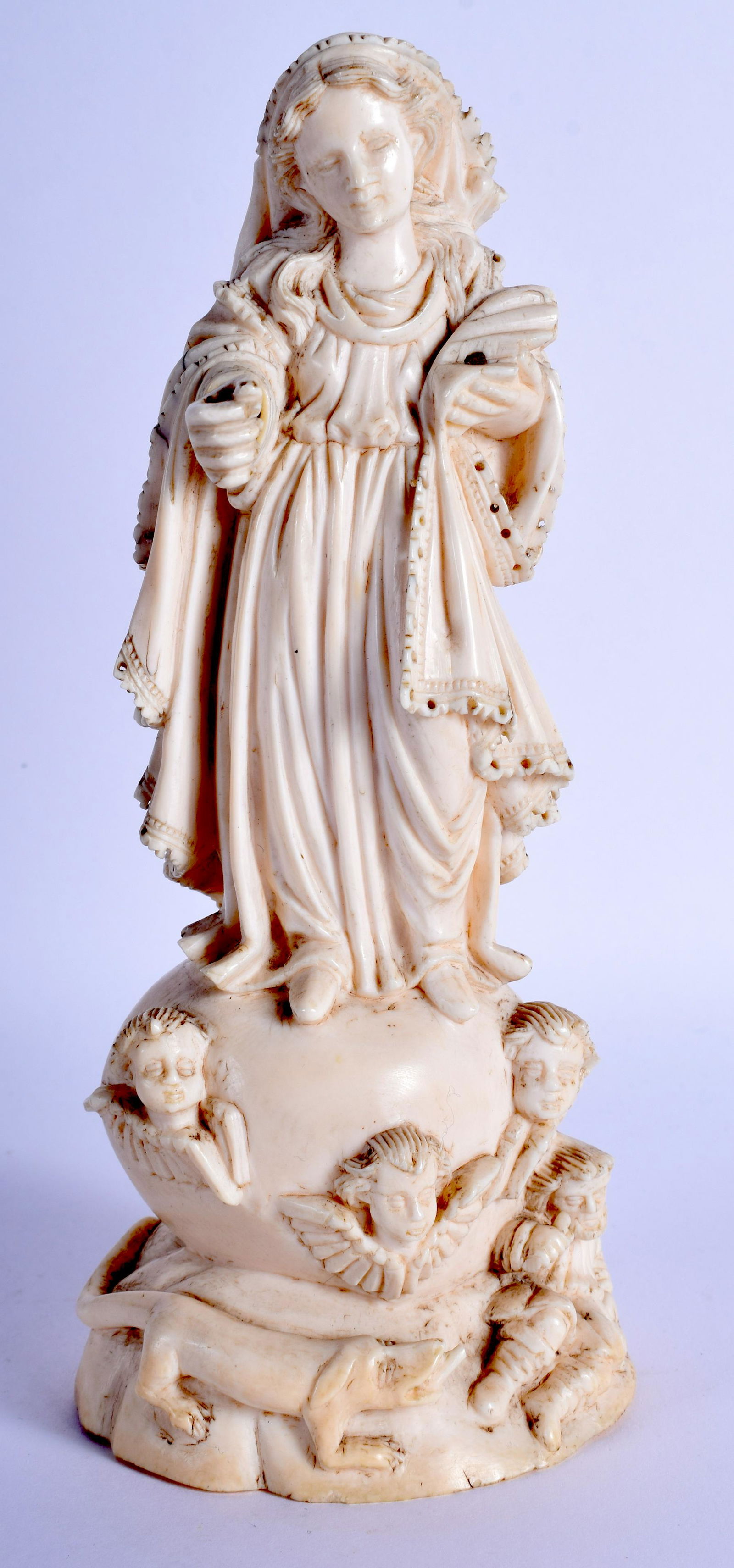 AN 18TH CENTURY CONTINENTAL GOA BONE FIGURE OF A FEMALE: AN 18TH CENTURY CONTINENTAL GOA BONE FIGURE OF A FEMALE modelled standing upon a shaped base. 18 cm high.