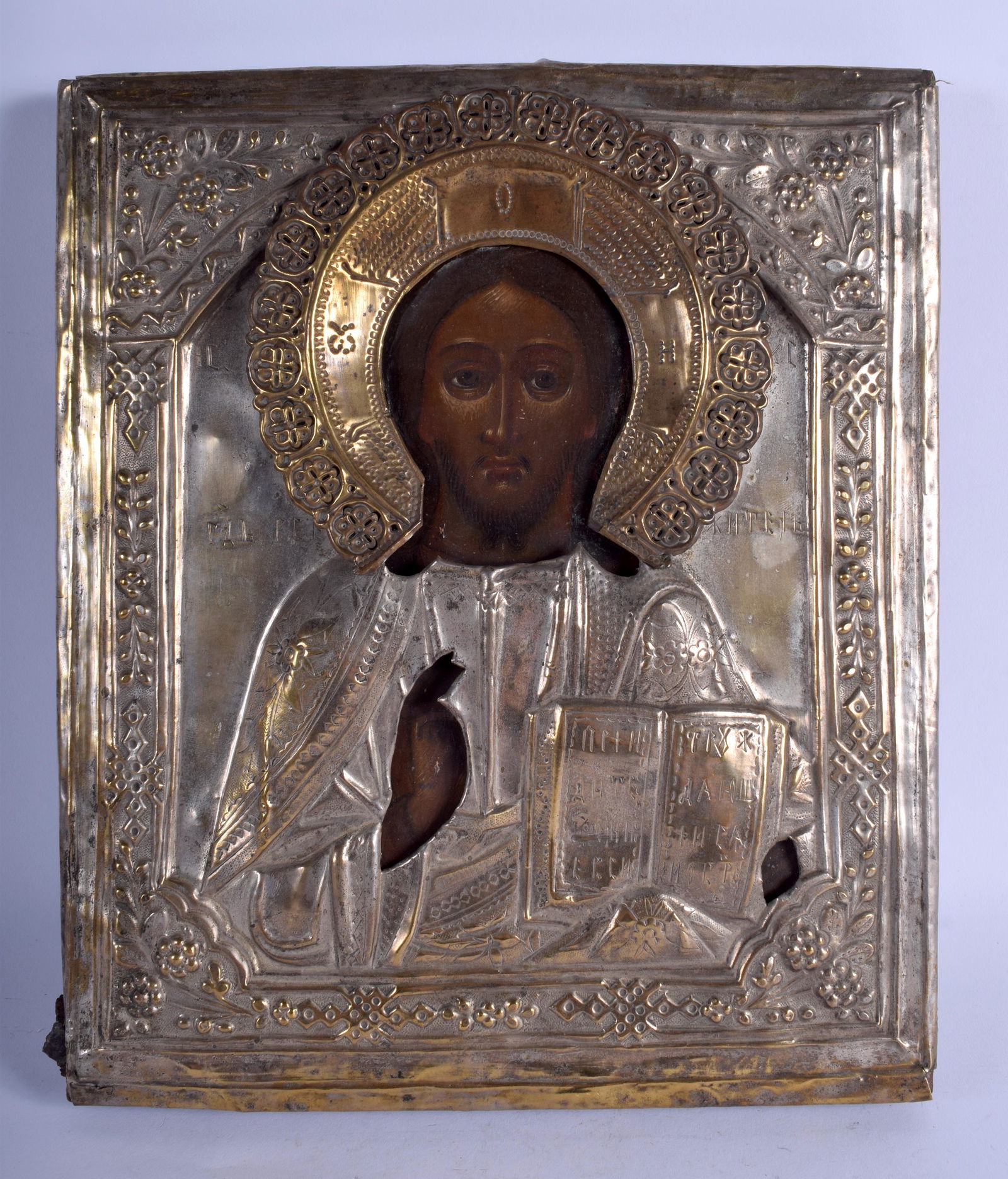 AN ANTIQUE CONTINENTAL SILVER PAINTED WOOD ICON (1 of 3)