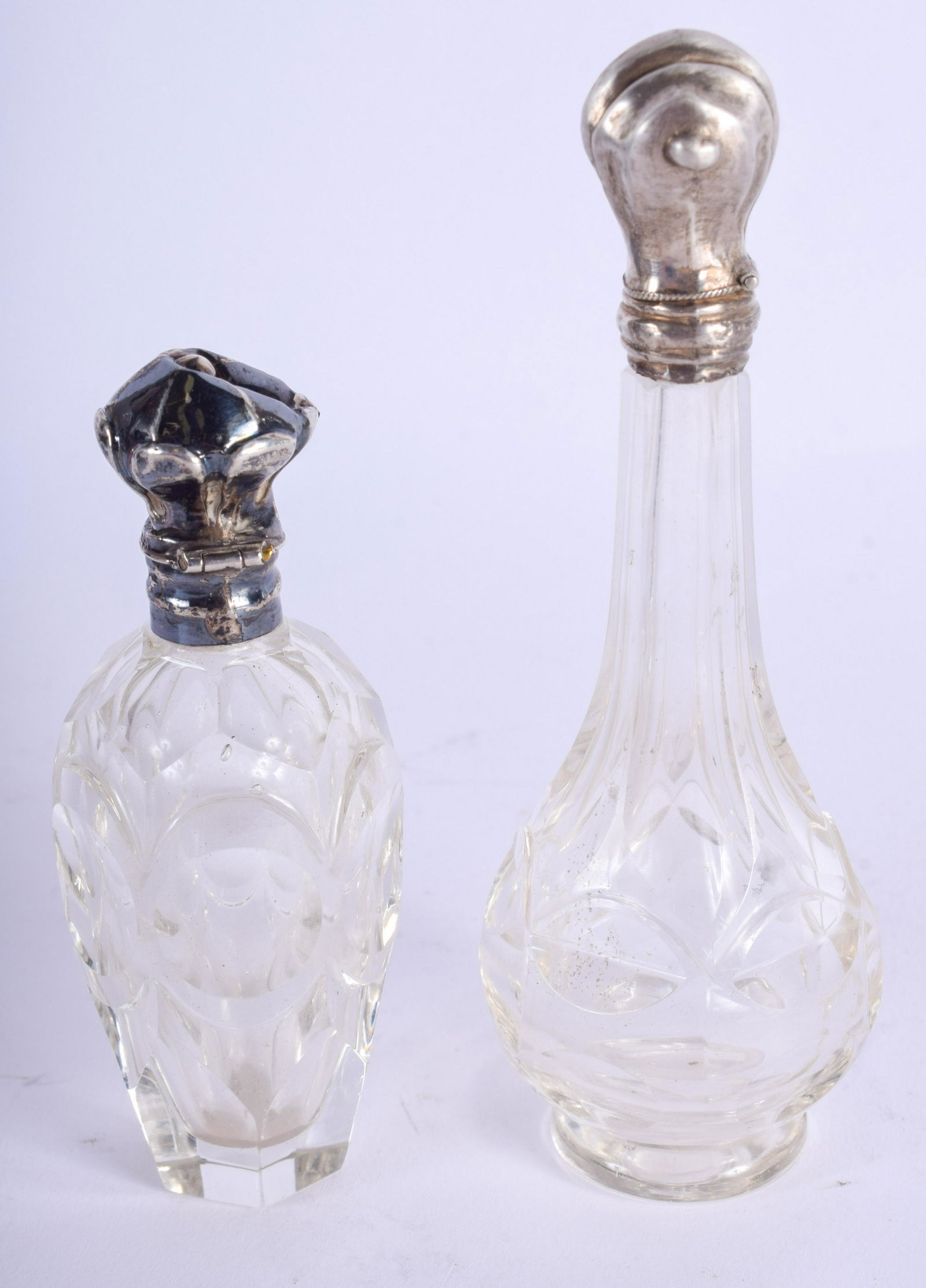 TWO ANTIQUE SILVER CUT GLASS SCENT BOTTLES. (2) (1 of 2)