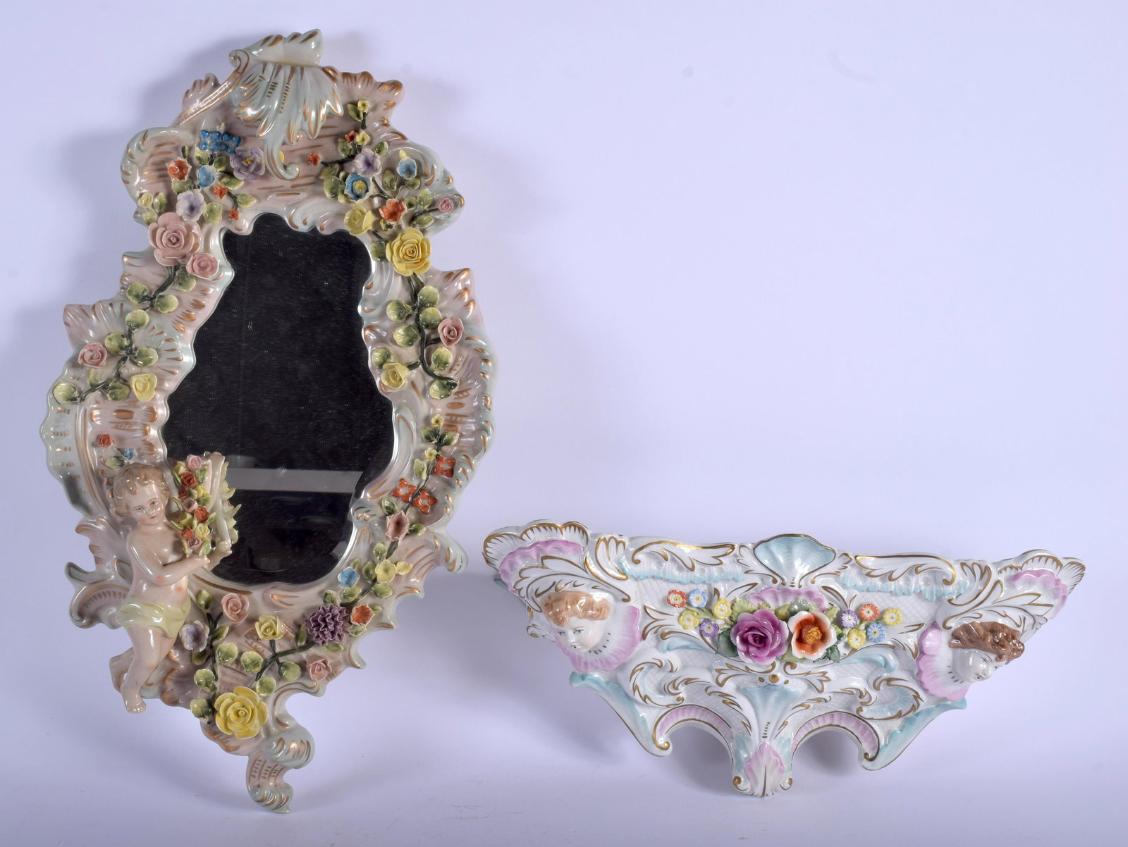 A CONTINENTAL PORCELAIN WALL BRACKET together with a: A CONTINENTAL PORCELAIN WALL BRACKET together with a mirror. 46 cm & 34 cm long. (2)