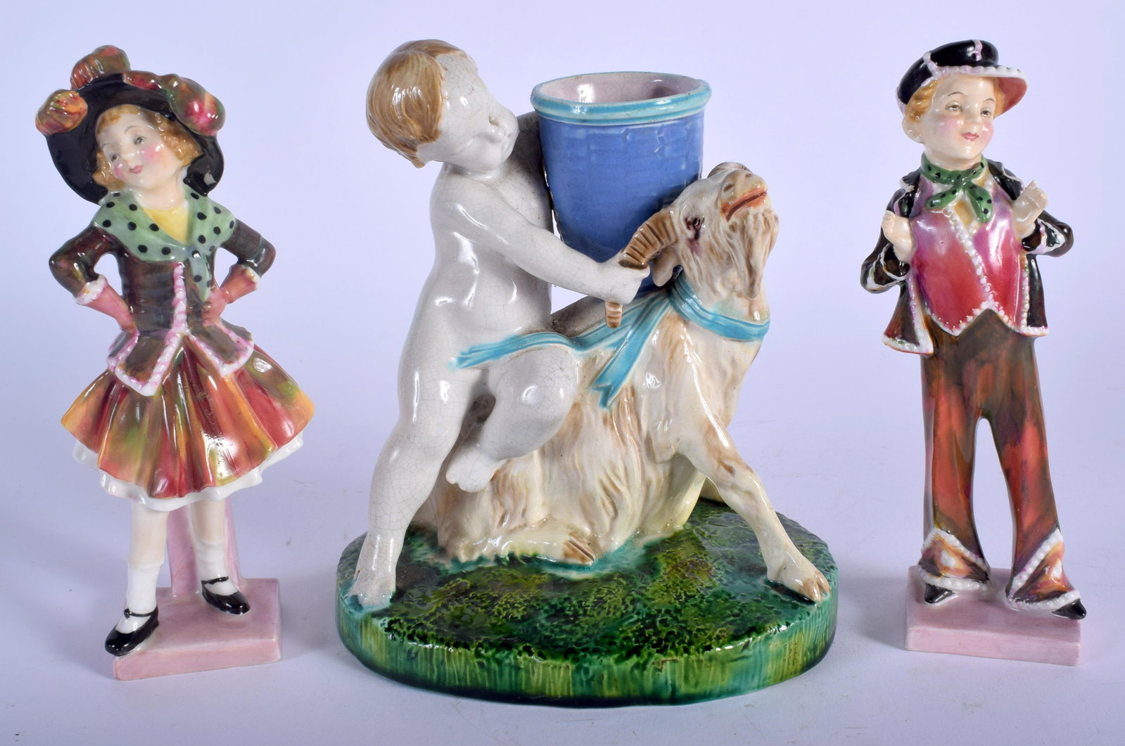 A 19TH CENTURY MINTON POTTERY GOAT SPILL VASE together: A 19TH CENTURY MINTON POTTERY GOAT SPILL VASE together with a pair of doulton figures. (3)