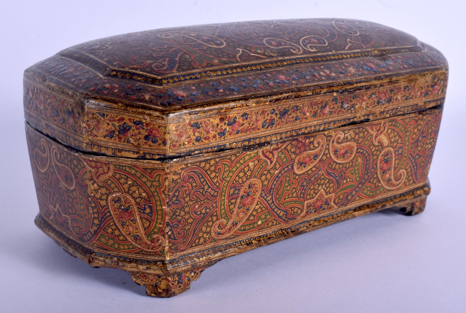 A FINE 19TH CENTURY MIDDLE EASTERN PERSIAN QAJAR: A FINE 19TH CENTURY MIDDLE EASTERN PERSIAN QAJAR LACQUER BOX AND COVER decorated with foliage and scrolls. 22 cm x 10 cm.