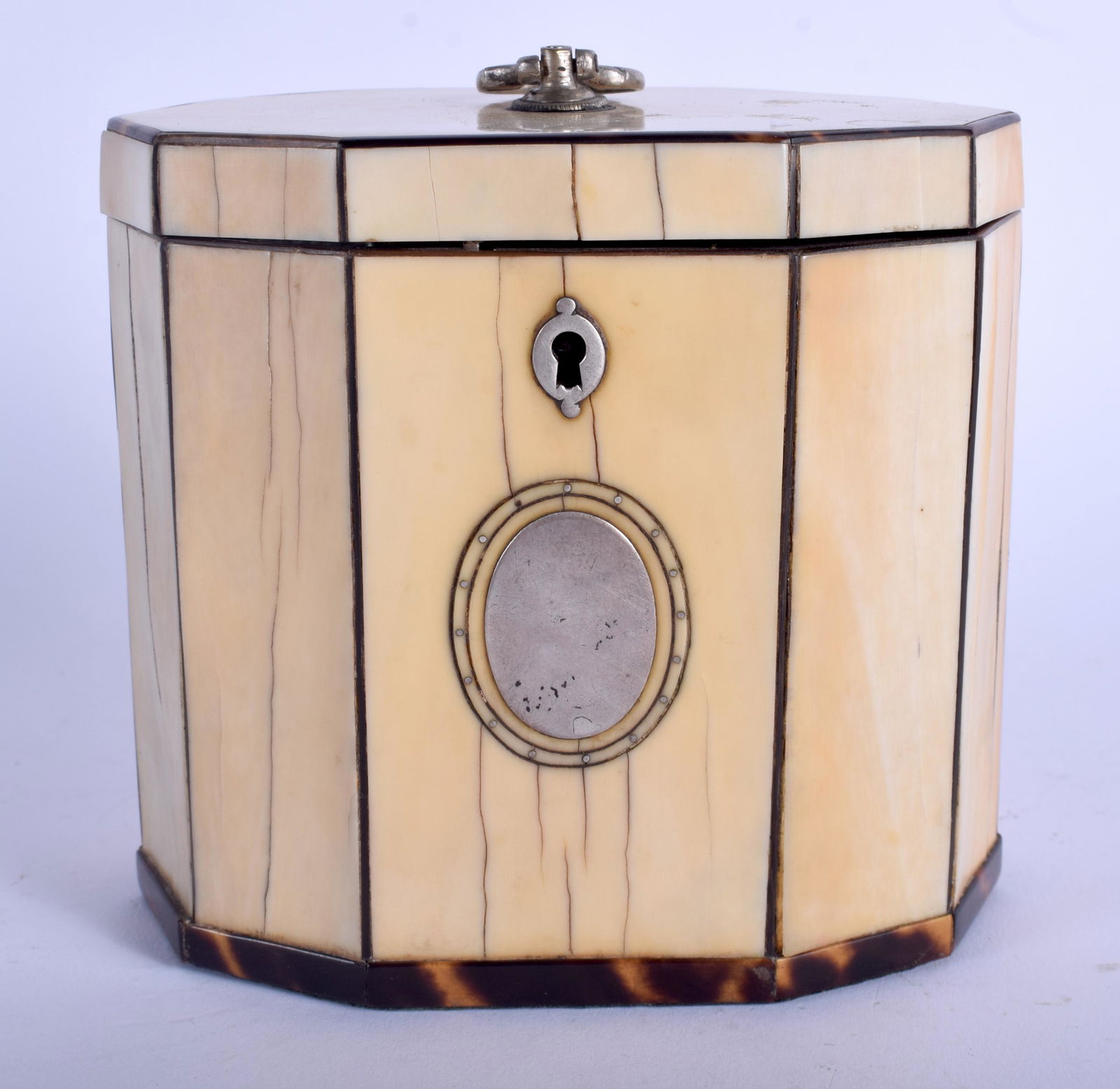 A GEORGE III CARVED bone AND shell TEA CADDY with: A GEORGE III CARVED bone AND shell TEA CADDY with silver mounts. 10 cm x 10 cm.