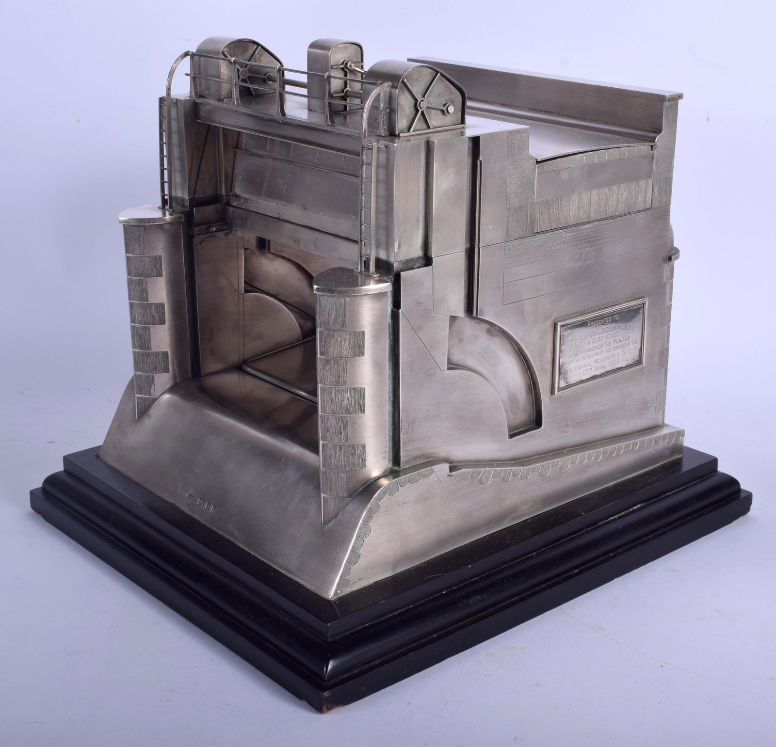 AN EXTREMELY RARE ENGLISH SILVER ART DECO MODEL OF THE: AN EXTREMELY RARE ENGLISH SILVER ART DECO MODEL OF THE SULEMANKI HEADWORKS by Wright & Davies (William Frederick Wright), with moving features and cigarette box top, upon an ebonised base. 26 cm x 26