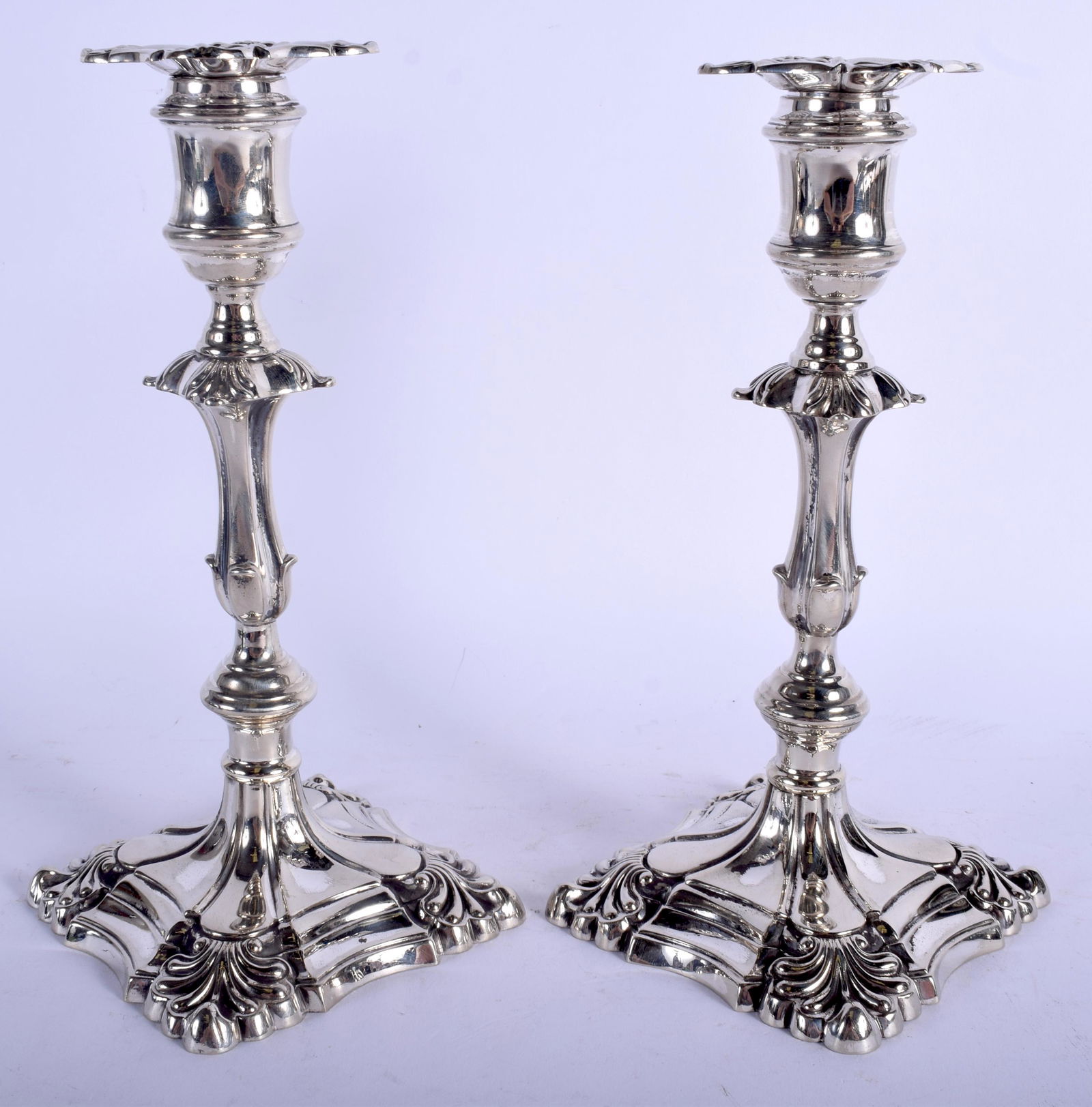 A PAIR OF GEORGE III PAKTONG CANDLESTICKS upon acanthus (1 of 3)