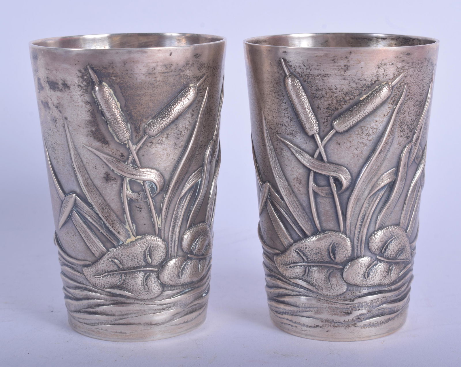 A PAIR OF CONTINENTAL SILVER BEAKERS decorated with (1 of 4)