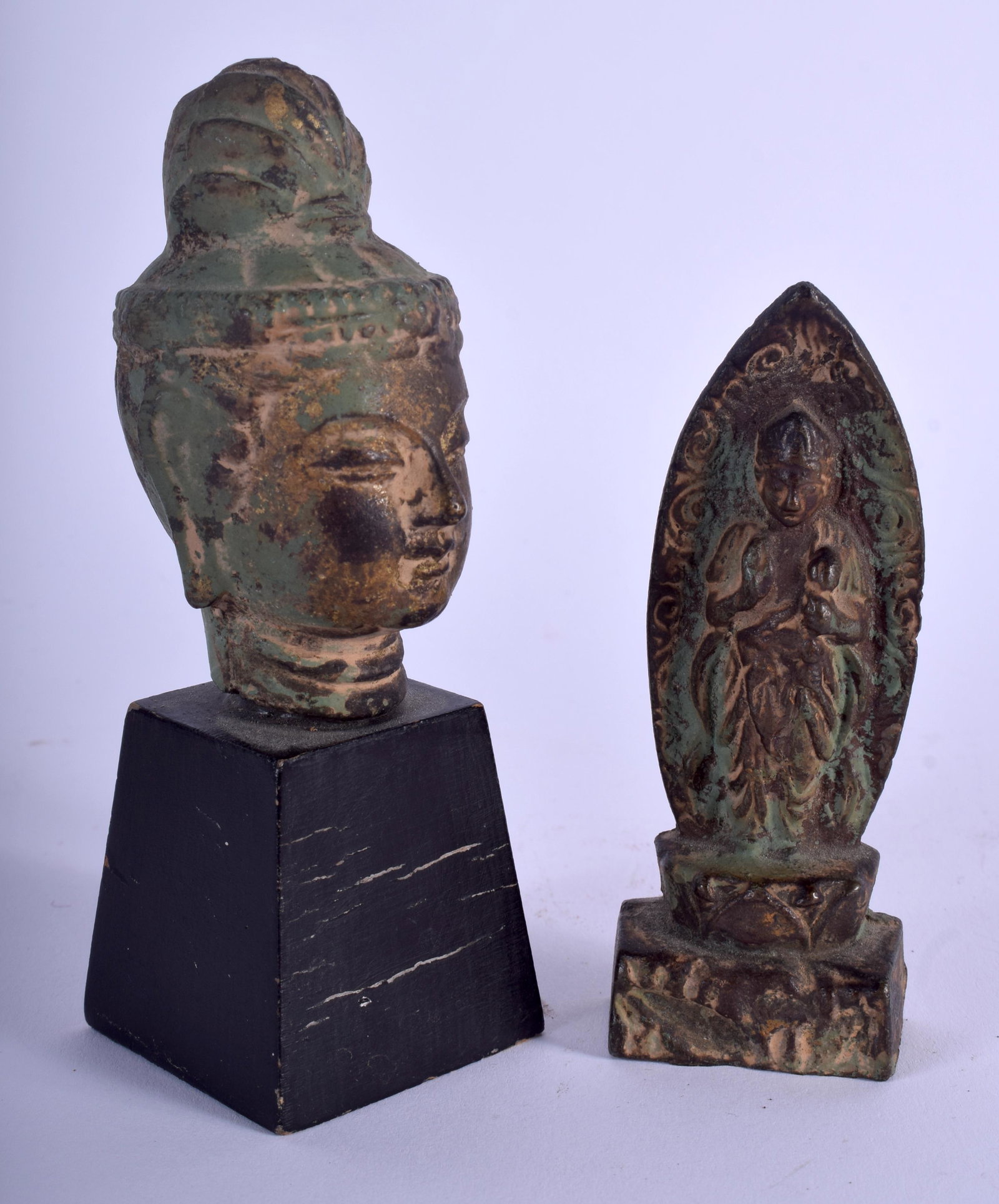 AN EARLY 20TH CENTURY JAPANESE MEIJI PERIOD BRONZE: AN EARLY 20TH CENTURY JAPANESE MEIJI PERIOD BRONZE BUDDHA HEAd together with another. Largest 12.5 cm high. (2)
