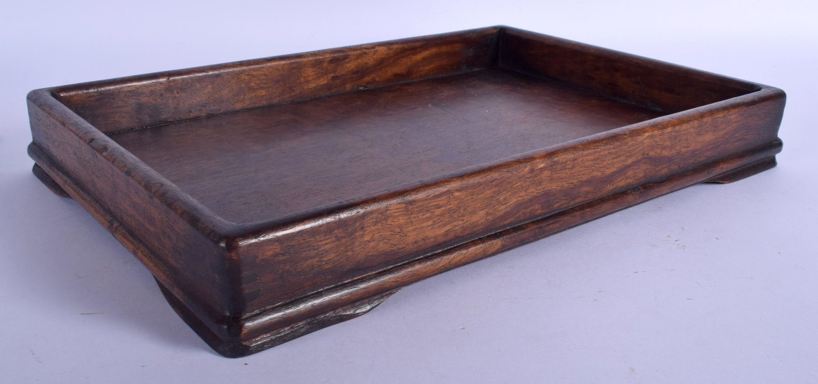 AN EARLY 20TH CENTURY CHINESE CARVED HARDWOOD: AN EARLY 20TH CENTURY CHINESE CARVED HARDWOOD RECTANGULAR TRAY Late Qing/Republic. 33 cm x 20 cm.