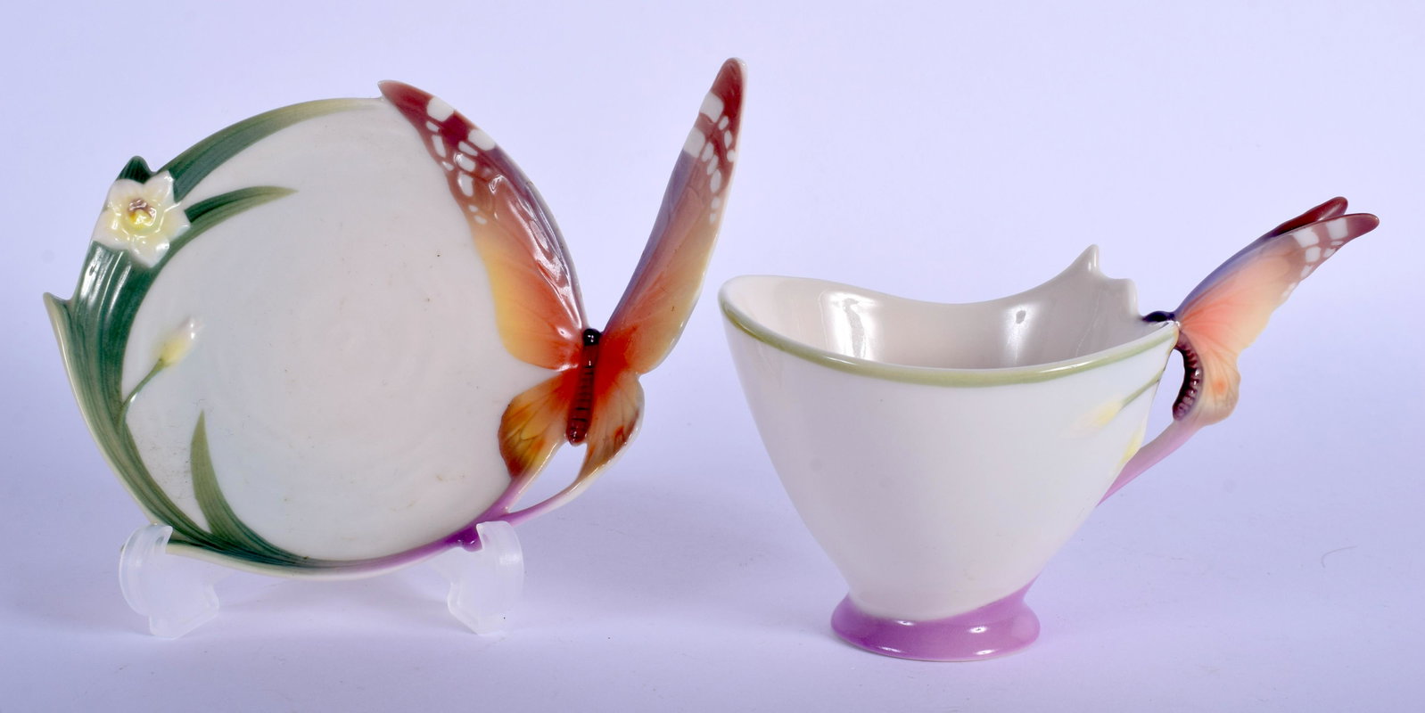20th c. Franz teacup and saucer with butterfly wing: 20th c. Franz teacup and saucer with butterfly wing handle , marked xp1693 FRANZ and signature.