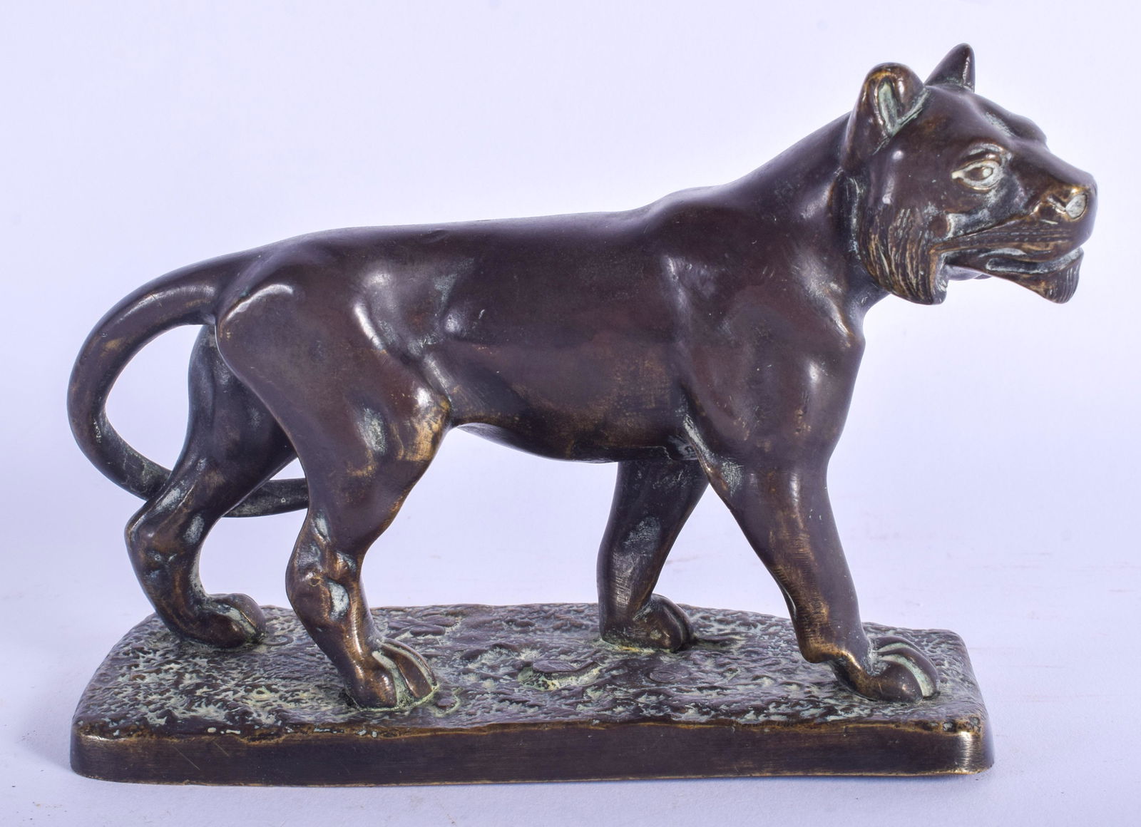 AN 18TH CENTURY CONTINENTAL BRONZE FIGURE OF A ROAMING: AN 18TH CENTURY CONTINENTAL BRONZE FIGURE OF A ROAMING LION possibly earlier, upon a rectangular base. 14 cm x 10 cm.