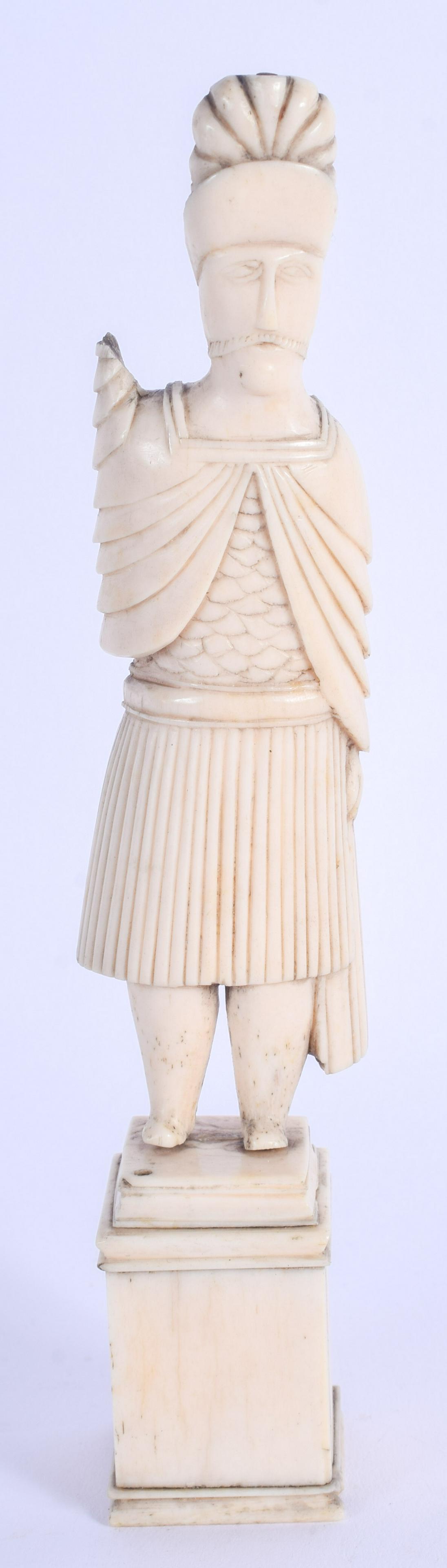 AN UNUSUAL 19TH CENTURY CONTINENTAL CARVED BONE FIGURE: AN UNUSUAL 19TH CENTURY CONTINENTAL CARVED BONE FIGURE OF A MALE upon a square base. 15 cm high.