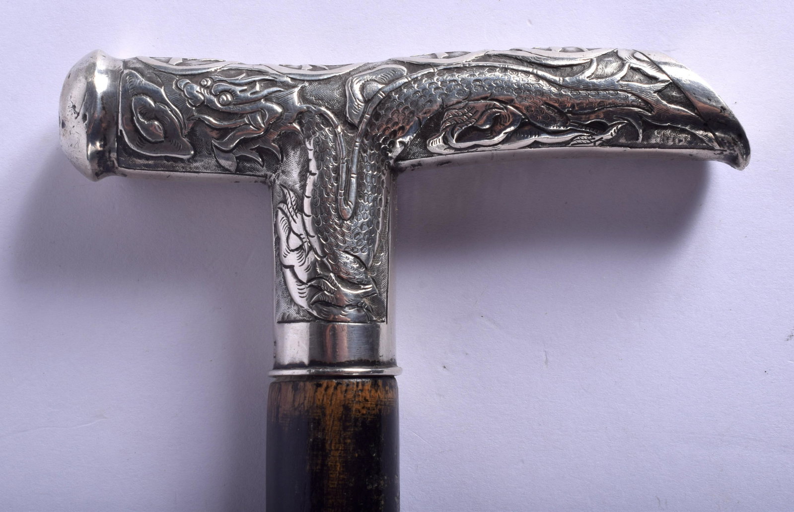 A 19TH CENTURY CHINESE SILVER HANDLED WALKING CANE: A 19TH CENTURY CHINESE SILVER HANDLED WALKING CANE decorated with dragons. 88 cm long.