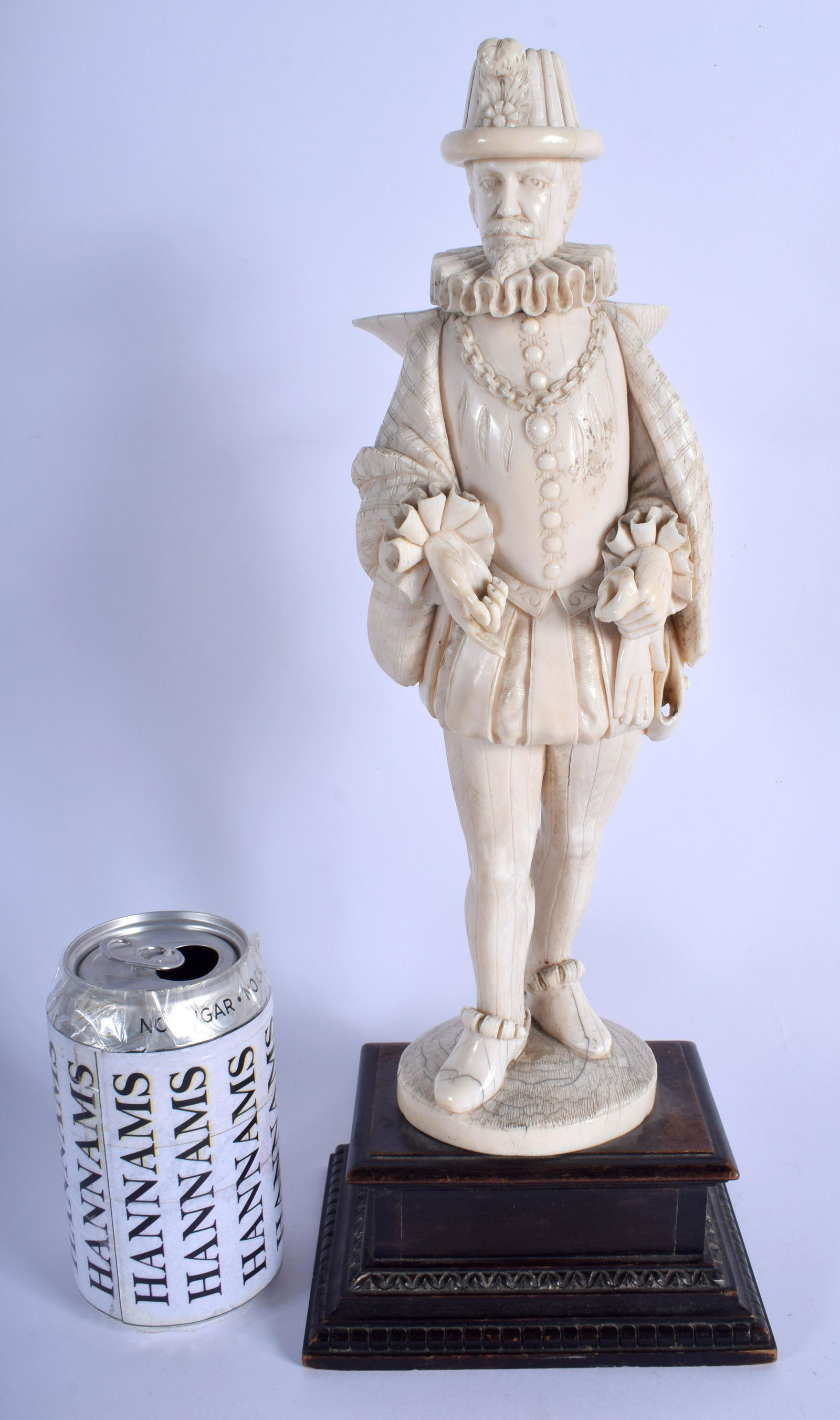 A LARGE 19TH CENTURY EUROPEAN BONE FIGURE OF A DANDY: A LARGE 19TH CENTURY EUROPEAN BONE FIGURE OF A DANDY modelled upon a wood base. BONE 35 cm high.