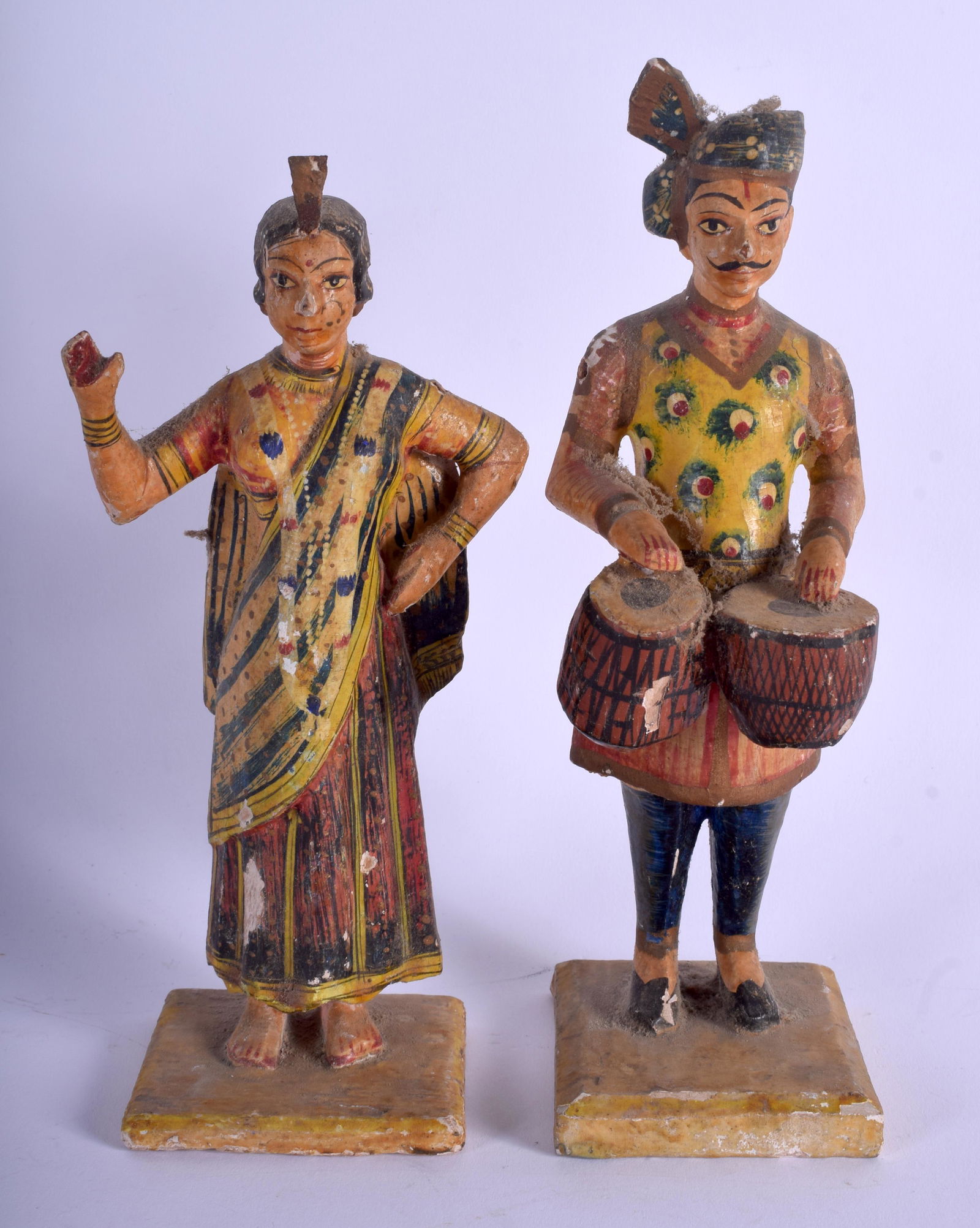A PAIR OF MIDDLE EASTERN ANTIQUE INDIAN RAJASTHAN: A PAIR OF MIDDLE EASTERN ANTIQUE INDIAN RAJASTHAN PAINTED WOOD FIGURES. 20 cm high.