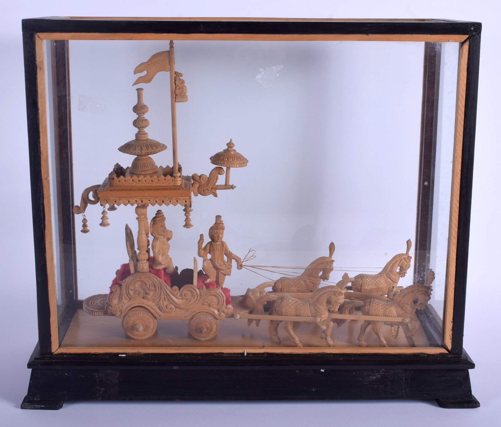 A 1950S SOUTH EAST ASIAN CARVED SANDALWOOD FIGURE OF A: A 1950S SOUTH EAST ASIAN CARVED SANDALWOOD FIGURE OF A CART modelled with attendants. Figure 37 cm x 32 cm.