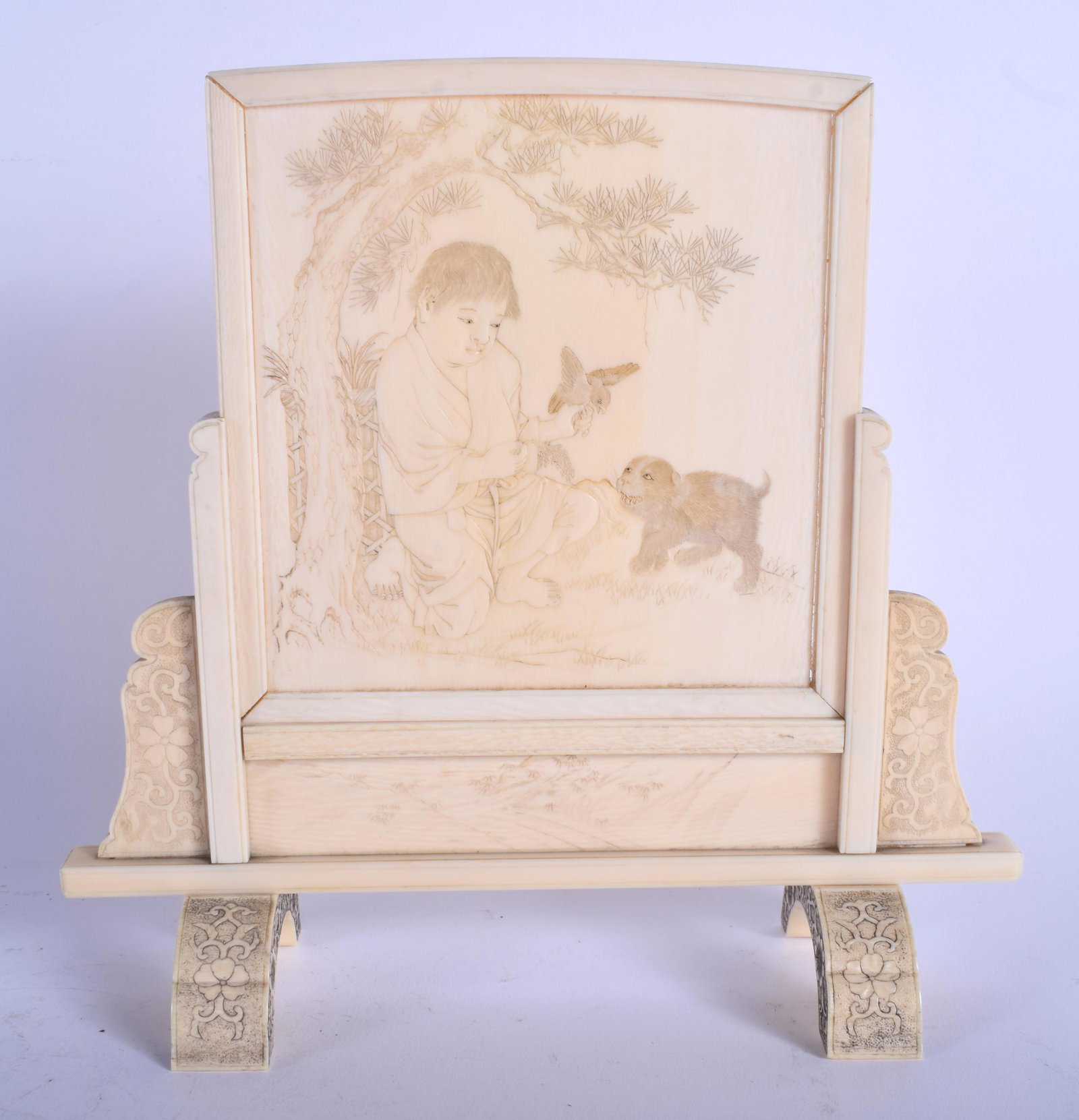 A 19TH CENTURY JAPANESE MEIJI PERIOD CARVED BONE: A 19TH CENTURY JAPANESE MEIJI PERIOD CARVED BONE SCHOLARS SCREEN ON STAND decorated with figures, birds and a hound. 20 cm x 16 cm.