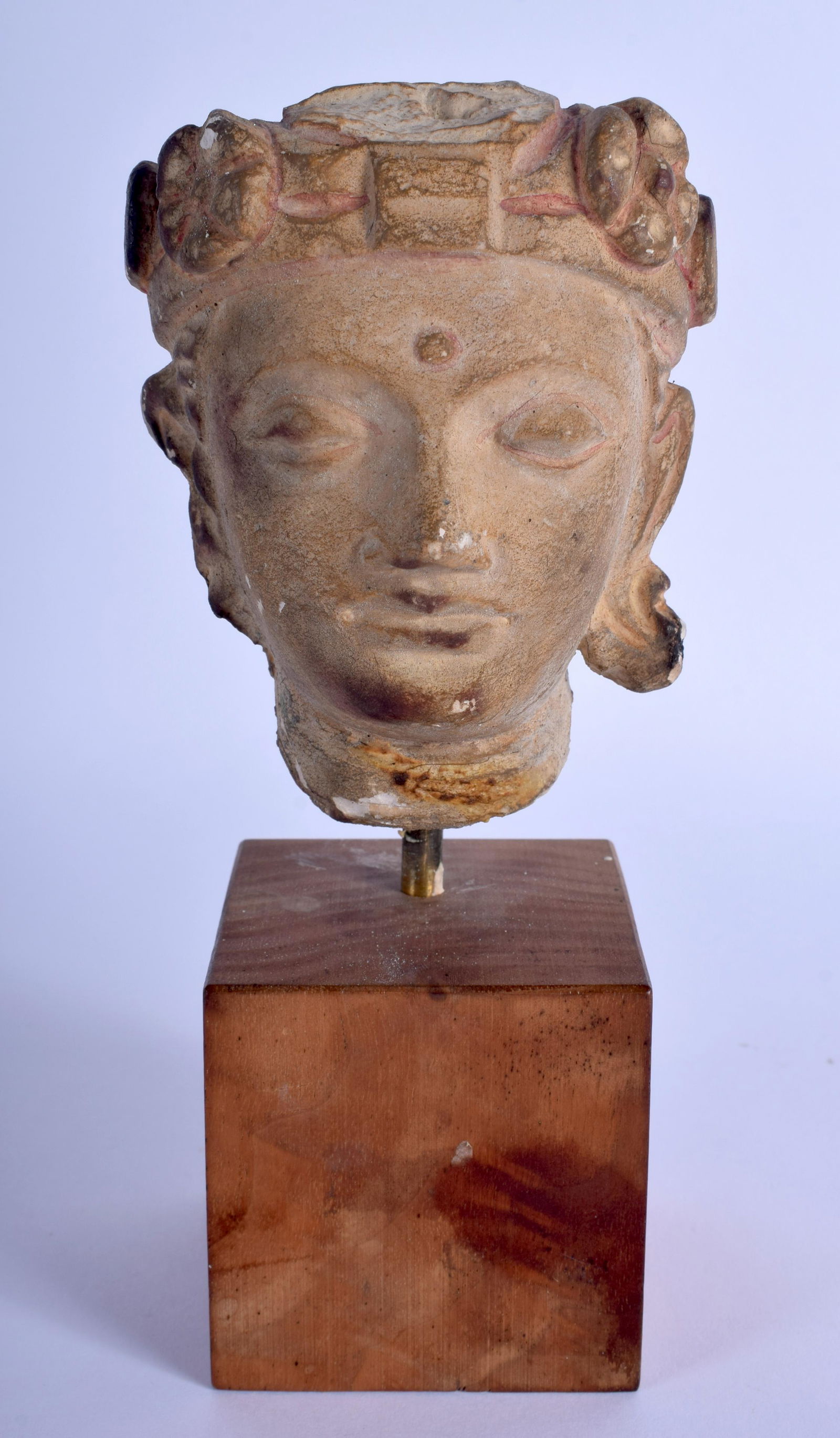AN UNUSUAL MIDDLE EASTERN PAINTED STUCCO HEAD modelled (1 of 3)