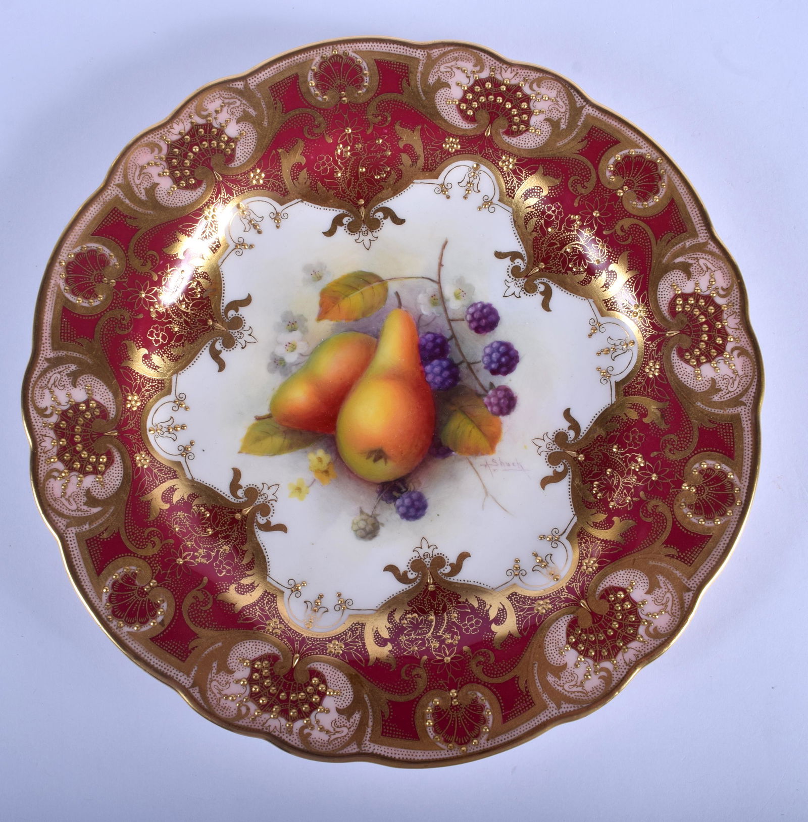 Royal Worcester plate painted with fruit under a: Royal Worcester plate painted with fruit under a crimson and gilt border date code 1929. 23cm diameter