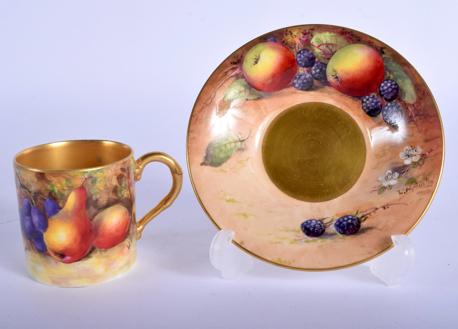 Royal Worcester fruit painted coffee can and saucer,: Royal Worcester fruit painted coffee can and saucer, the can painted by W. Bee, signed, the saucer by W. H. Austin signed, date codes for 1925. Saucer 11cm diameter